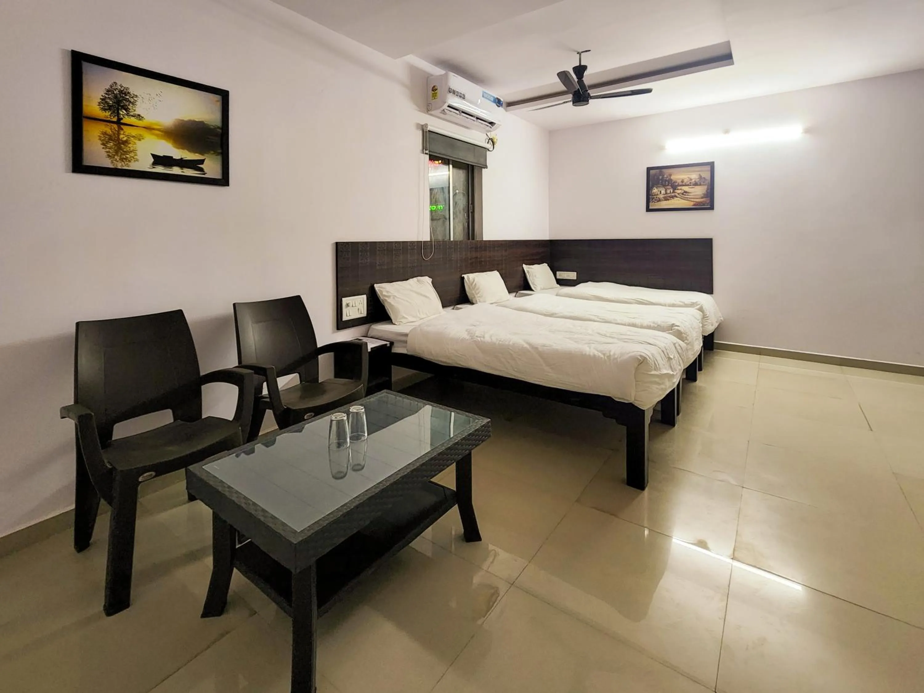 Photo of the whole room, Bed in Shivani Inn Hotel & Banquet