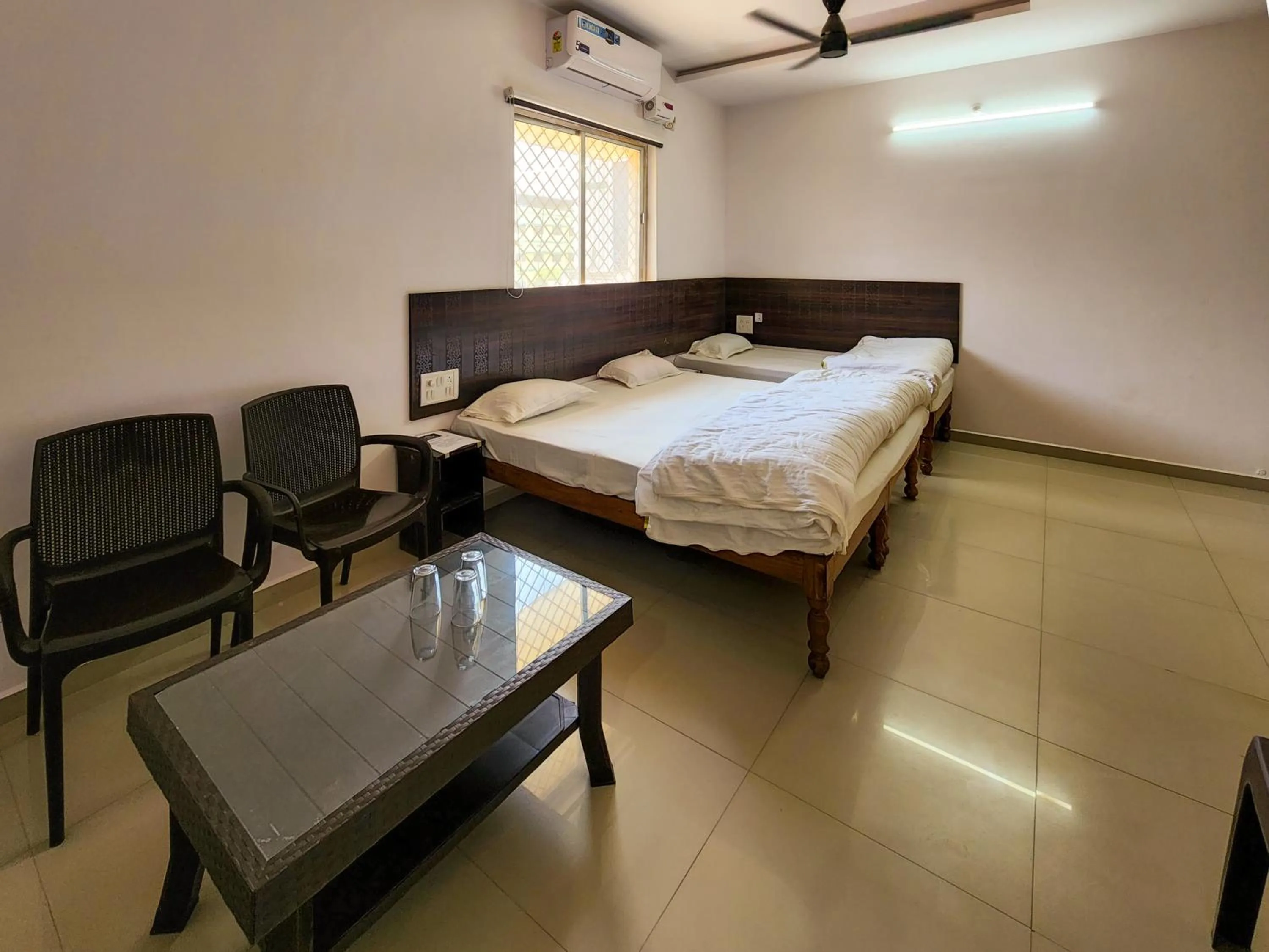 Photo of the whole room, Bed in Shivani Inn Hotel & Banquet