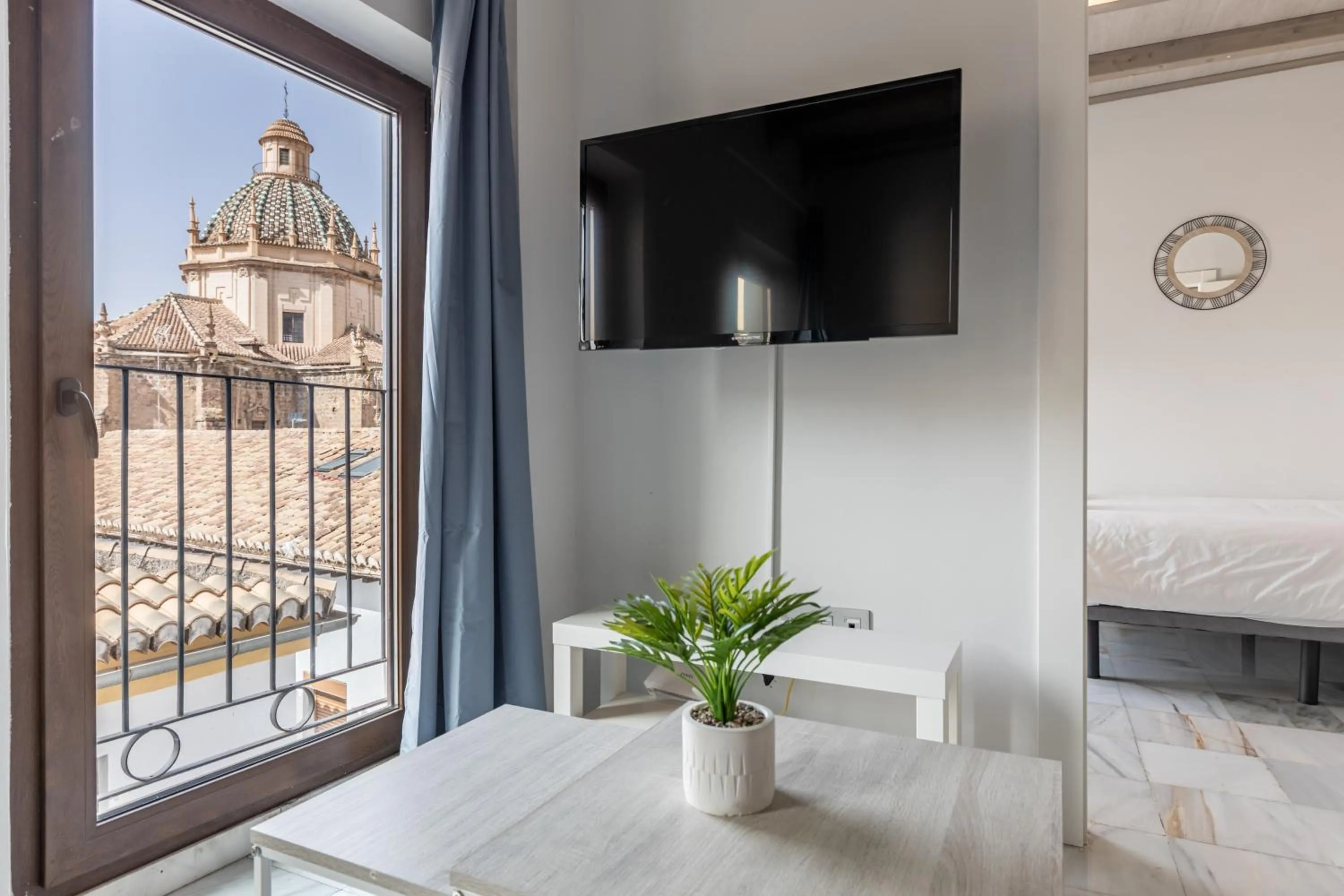 Living room, Bed in Apartamentos Realejo Granada Centro 3000