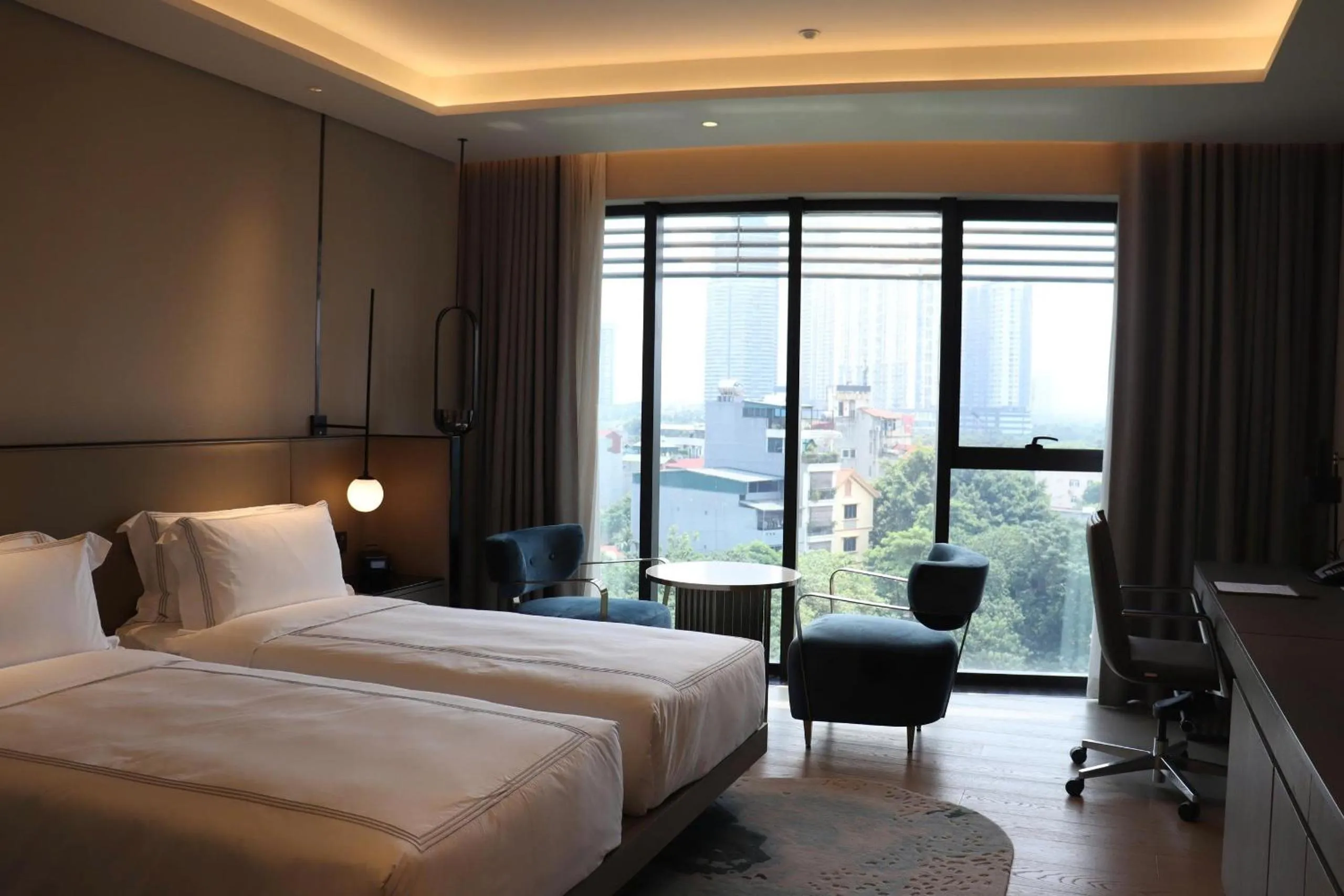 Bed in Fraser Residence Hanoi