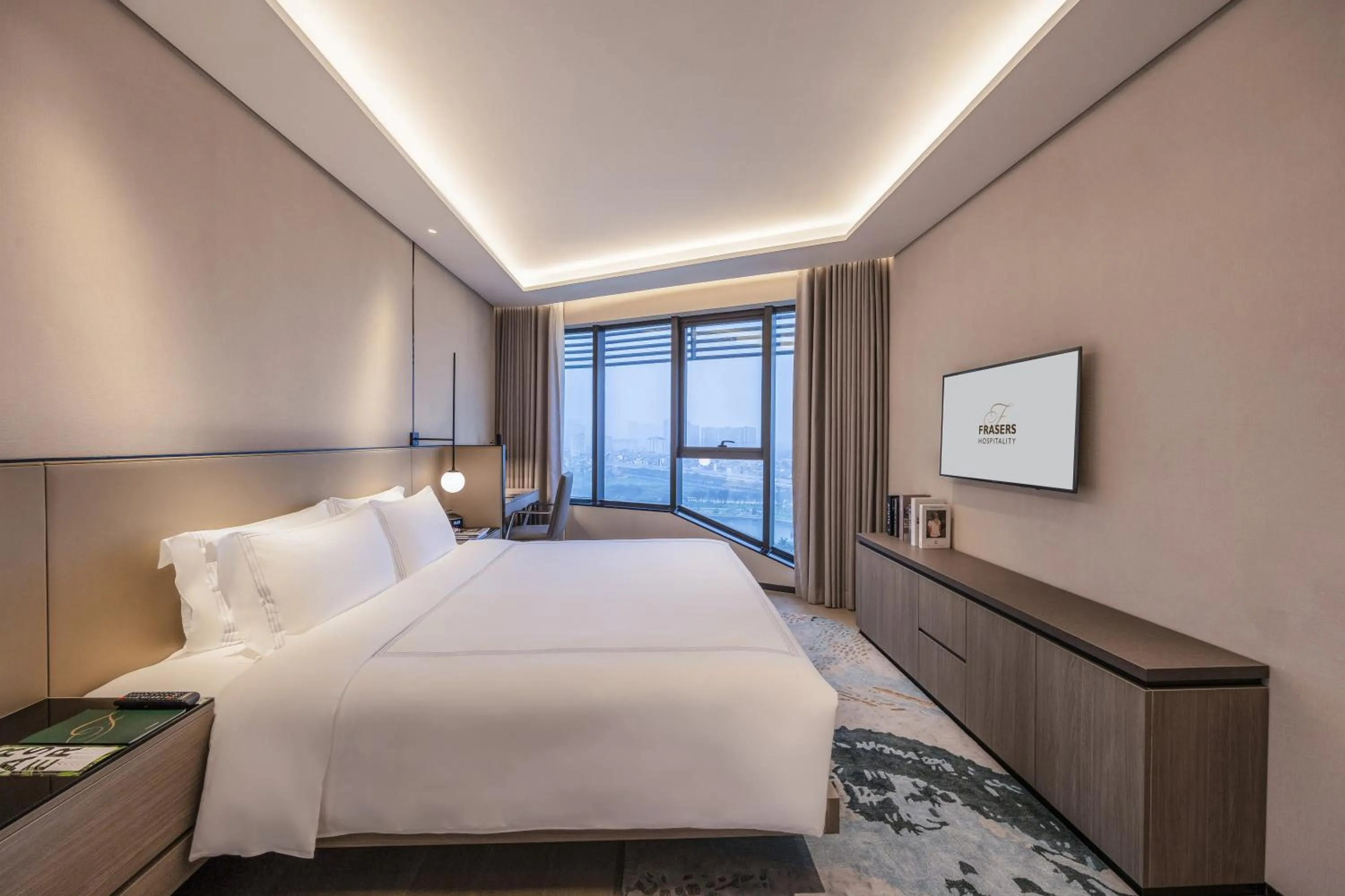 Bed in Fraser Residence Hanoi