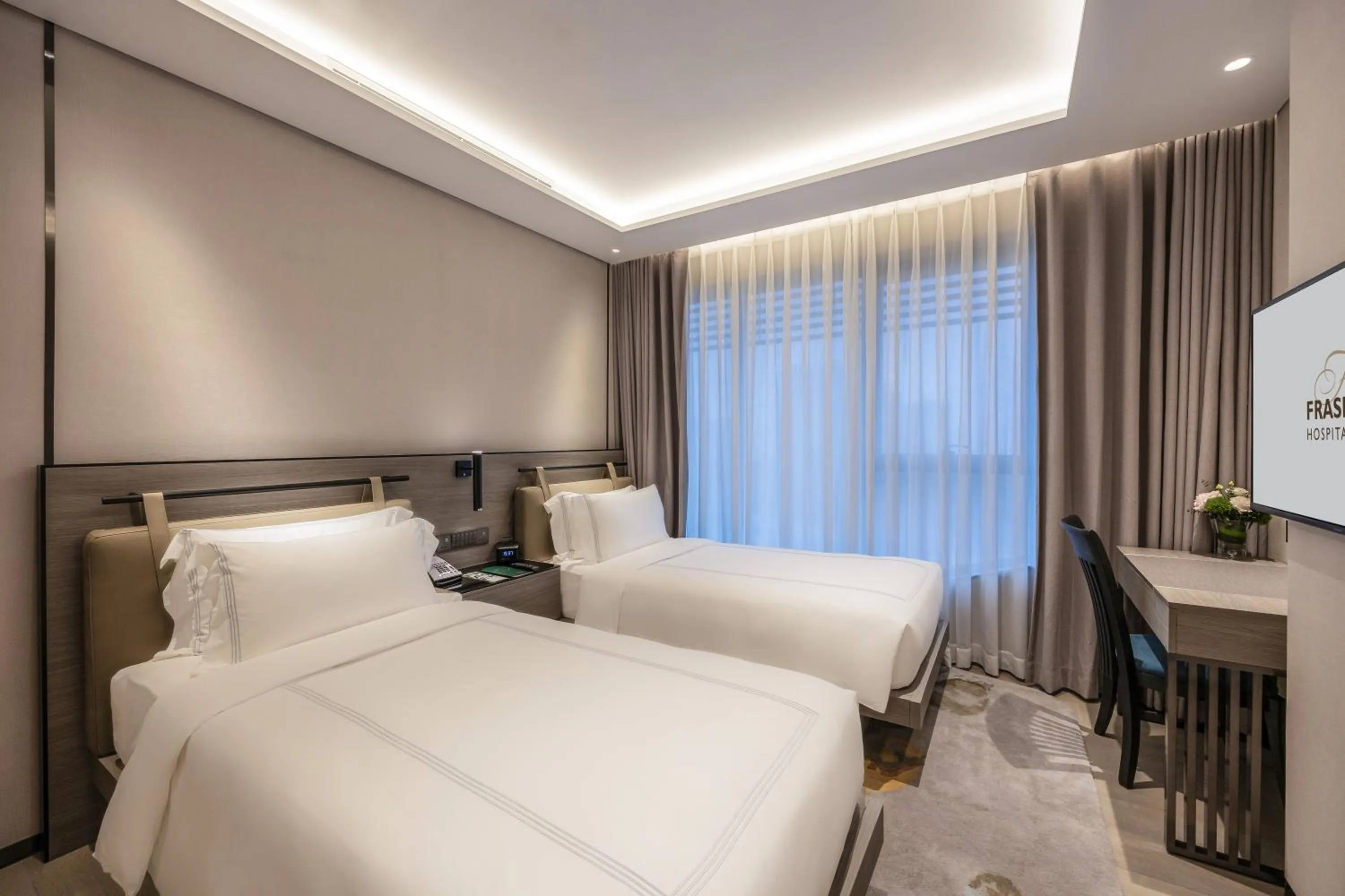 Bed in Fraser Residence Hanoi