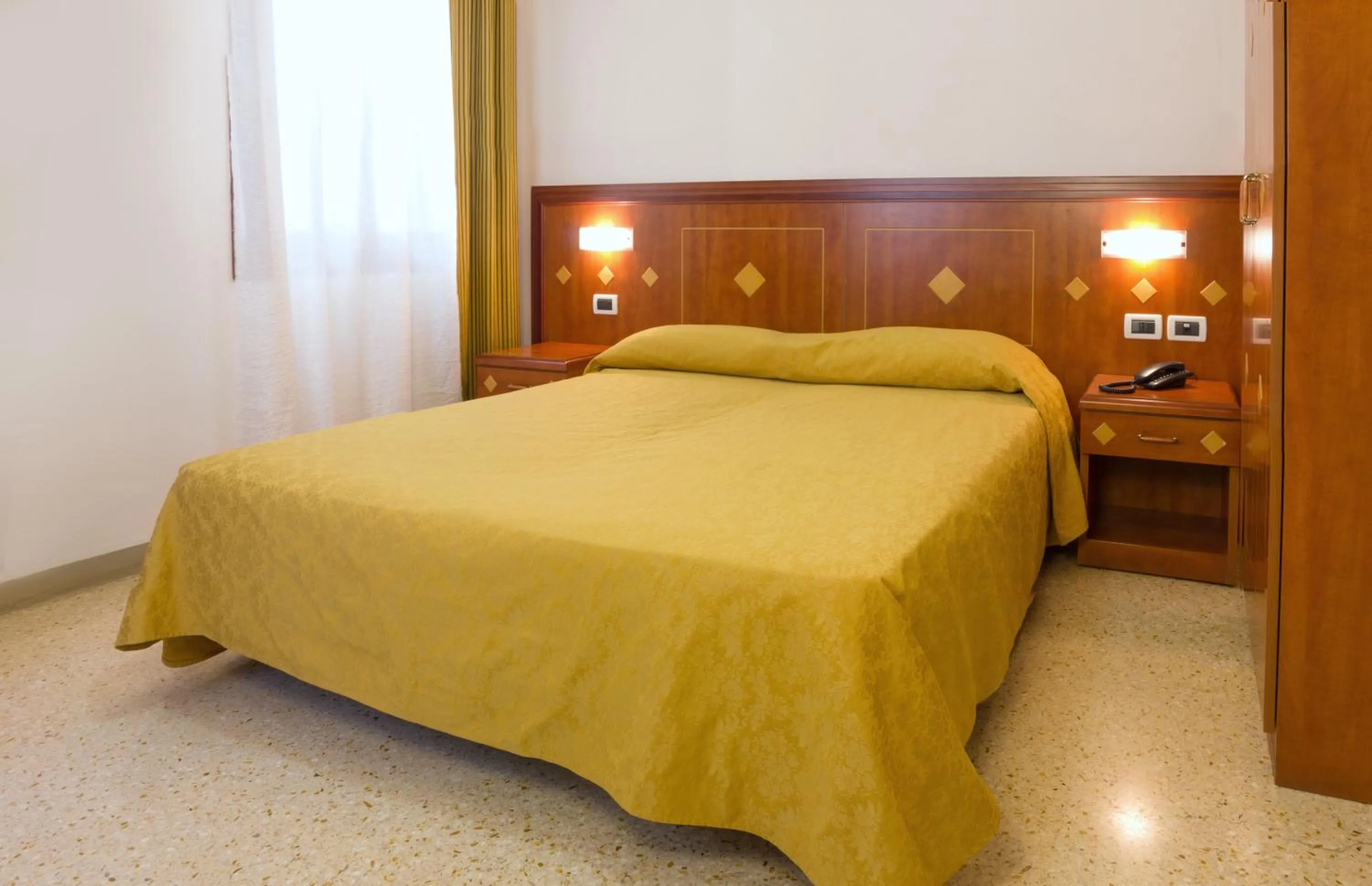 Bed in Hotel Adriatico