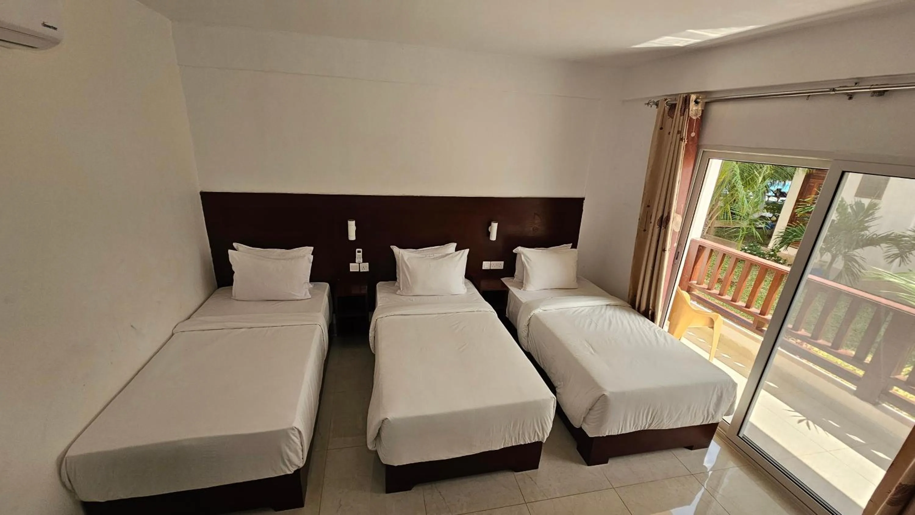 Bed in Malika Nungwi Hotel