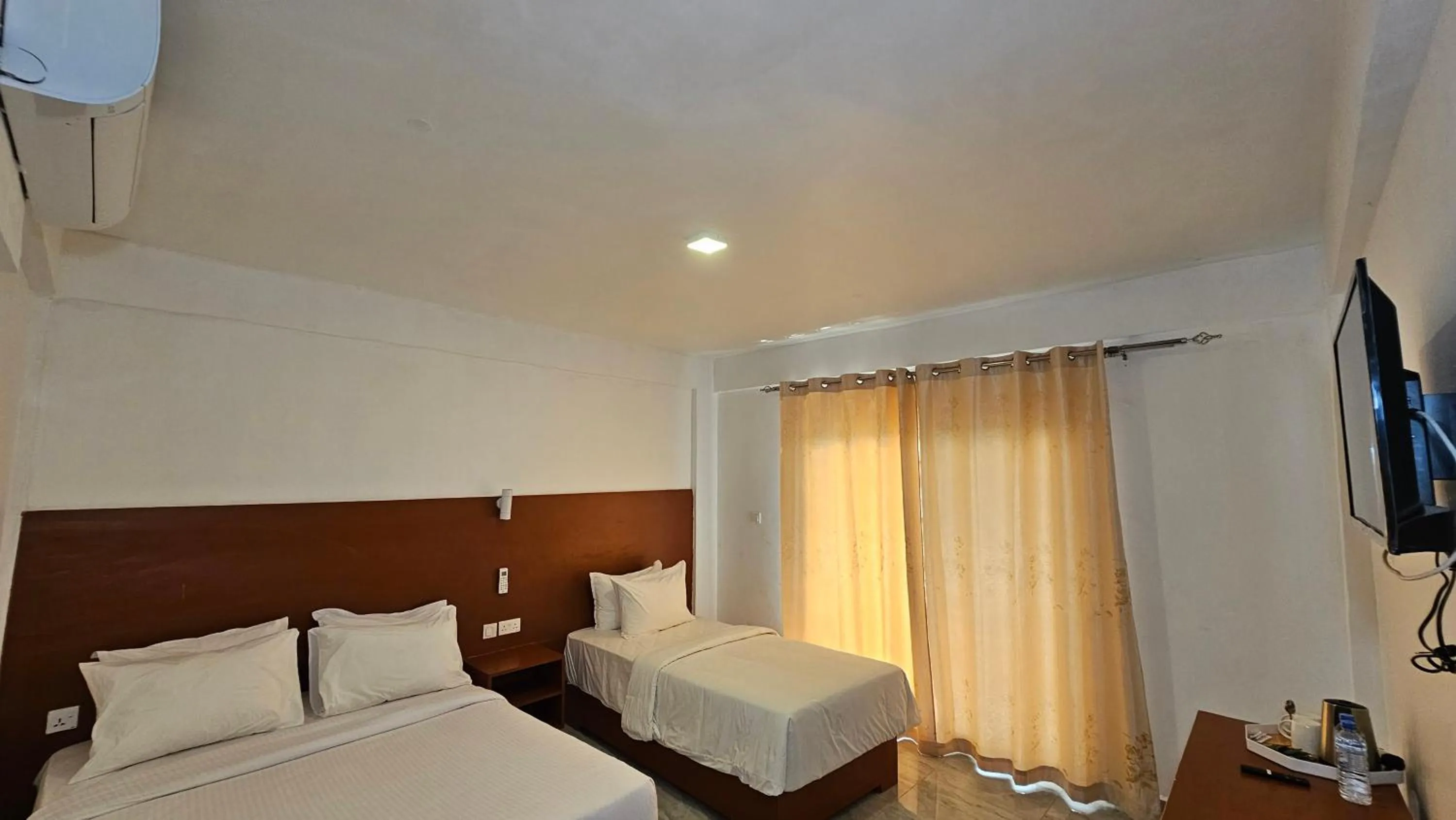 Bed in Malika Nungwi Hotel