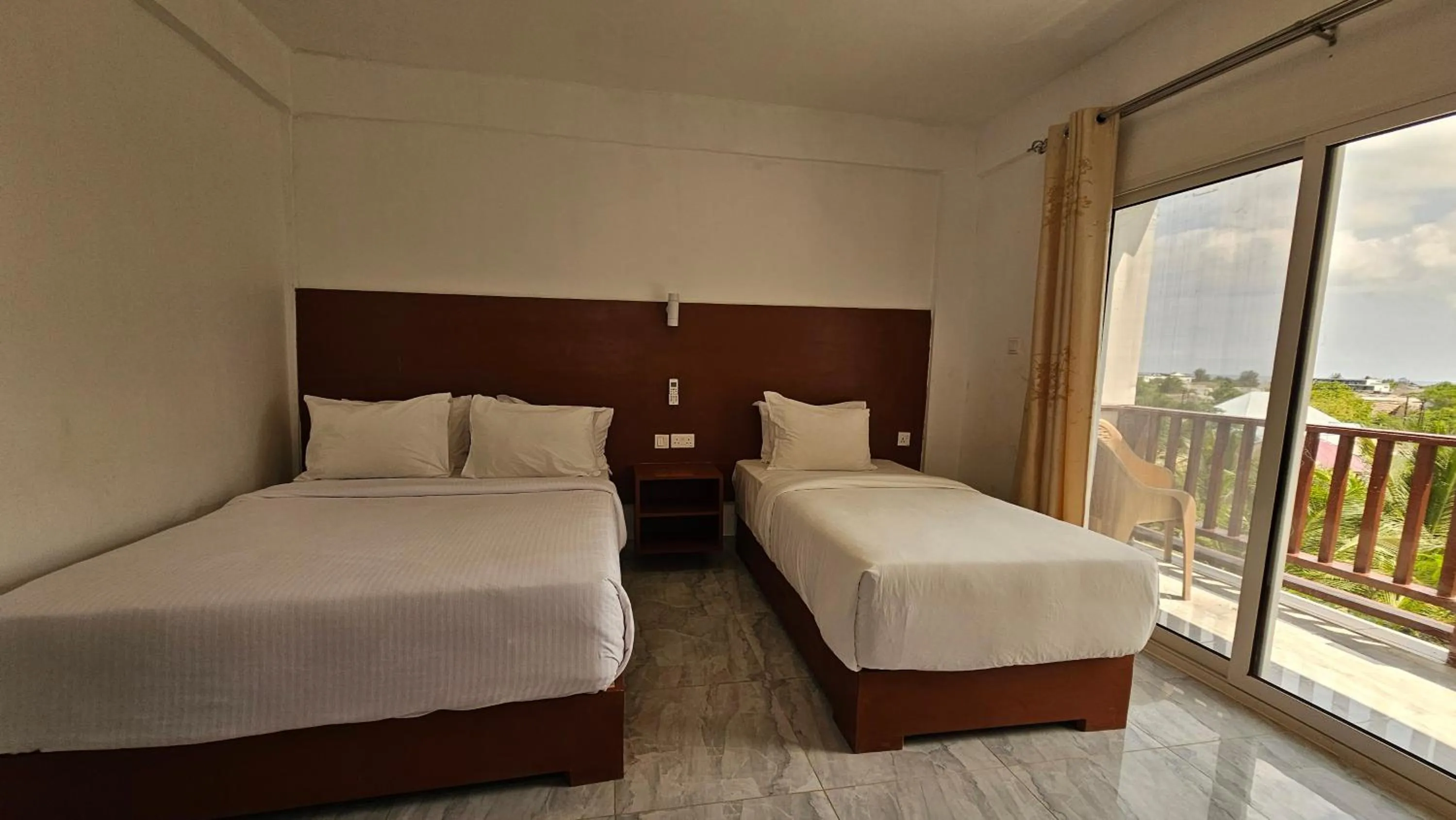 Bed in Malika Nungwi Hotel