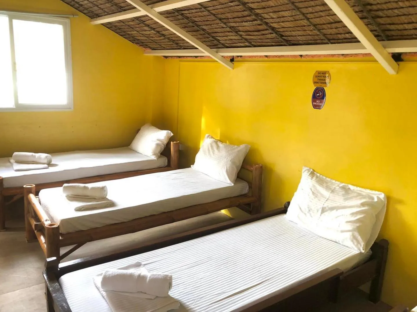 Bed in In Dai Aquasports and Beach Resort