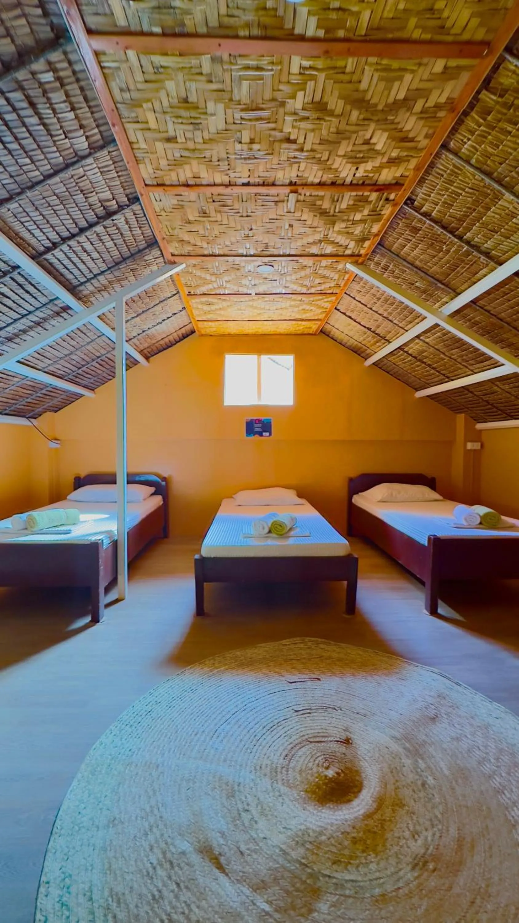 Bed in In Dai Aquasports and Beach Resort