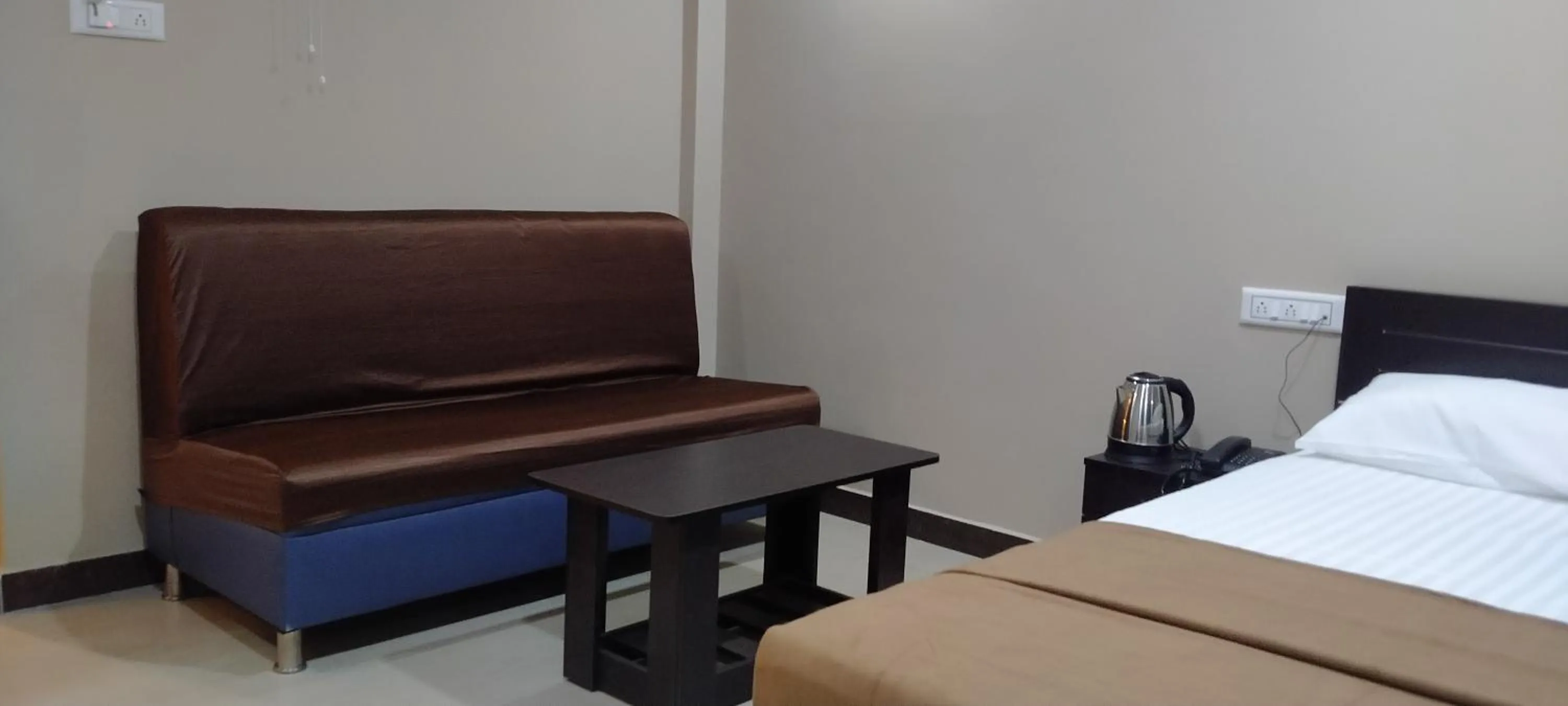 Seating area, Bed in THE NISARGA GRAND