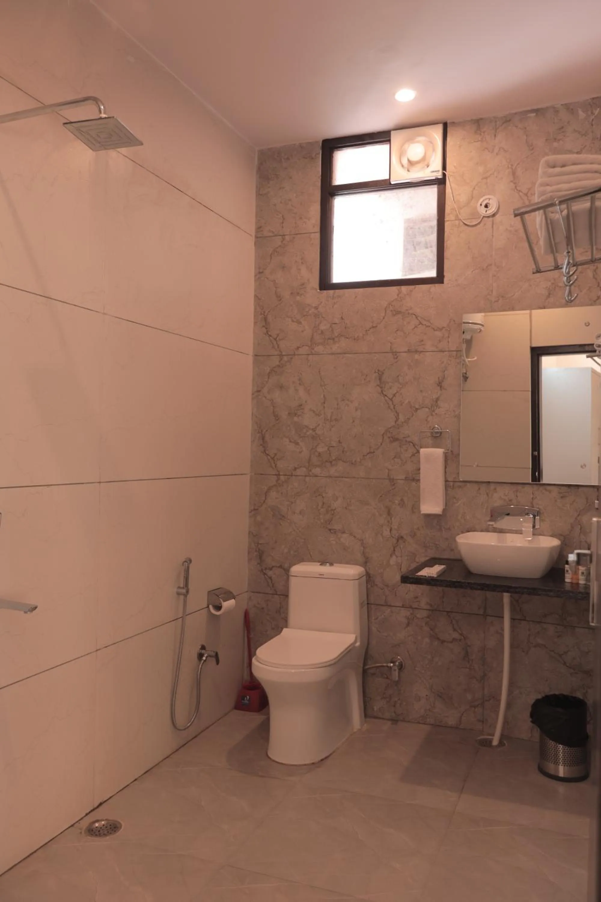 Shower in Yogved Hospitality & Resort