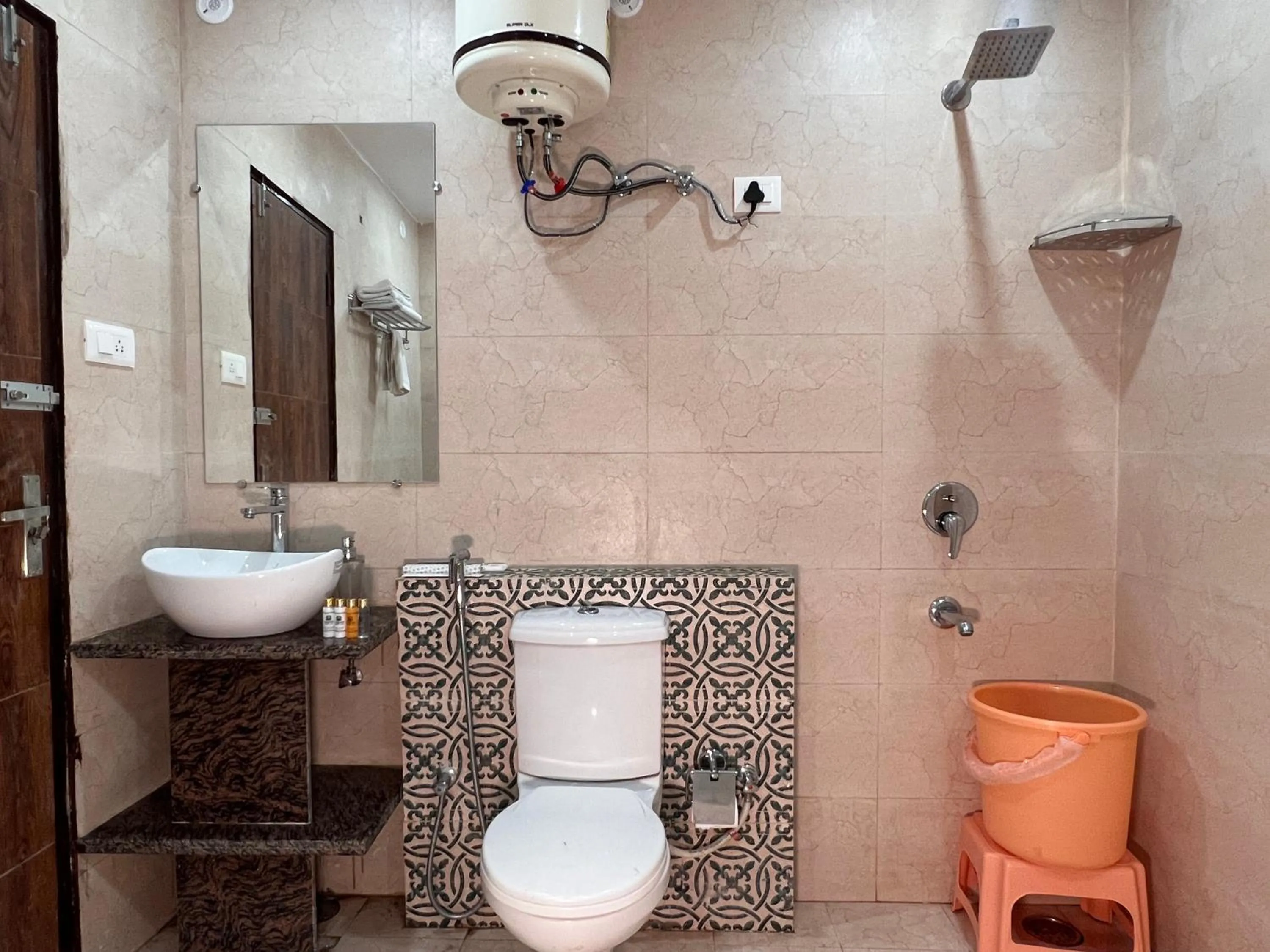 Shower in Yogved Hospitality & Resort