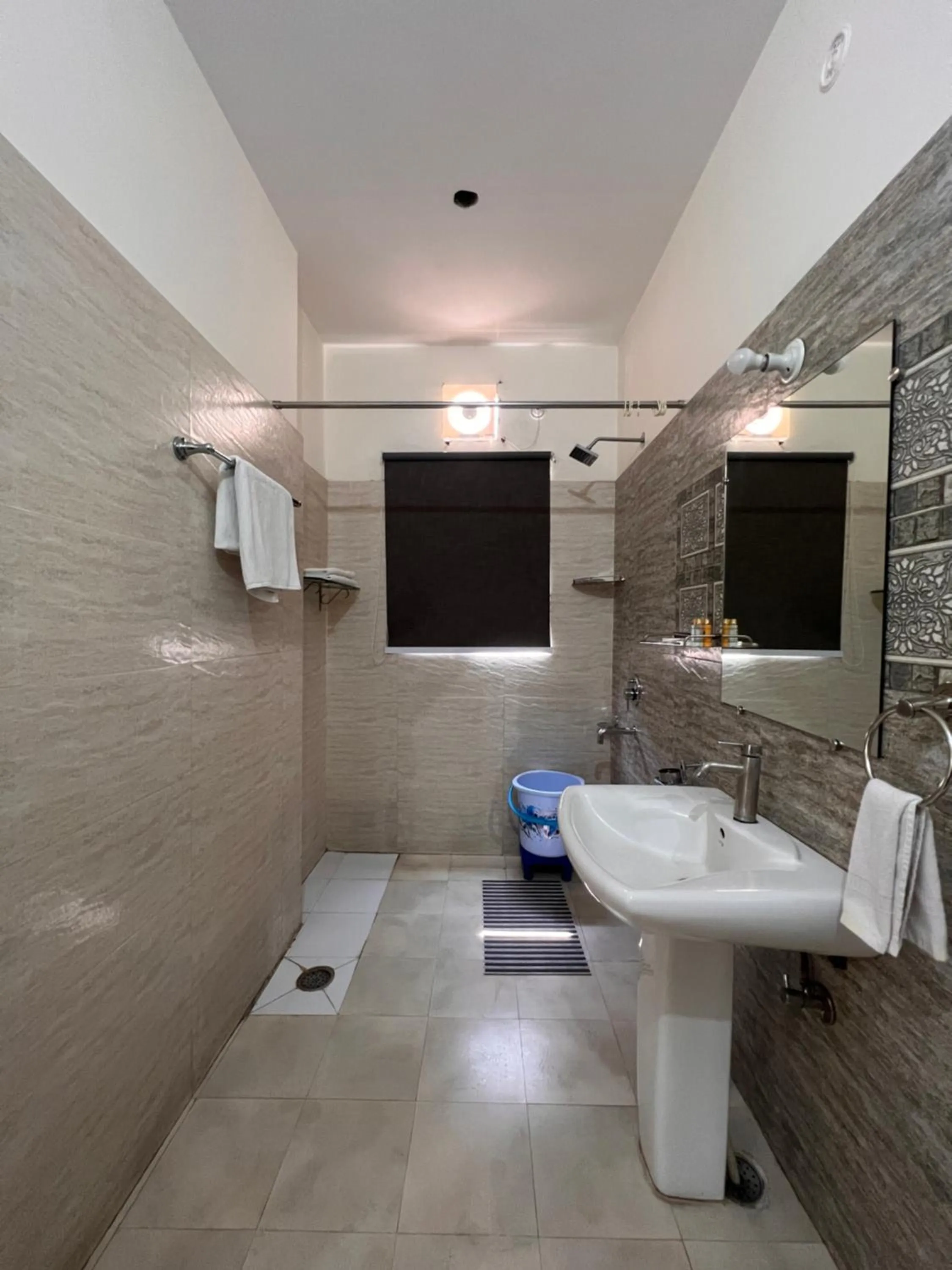 Shower in Yogved Hospitality & Resort