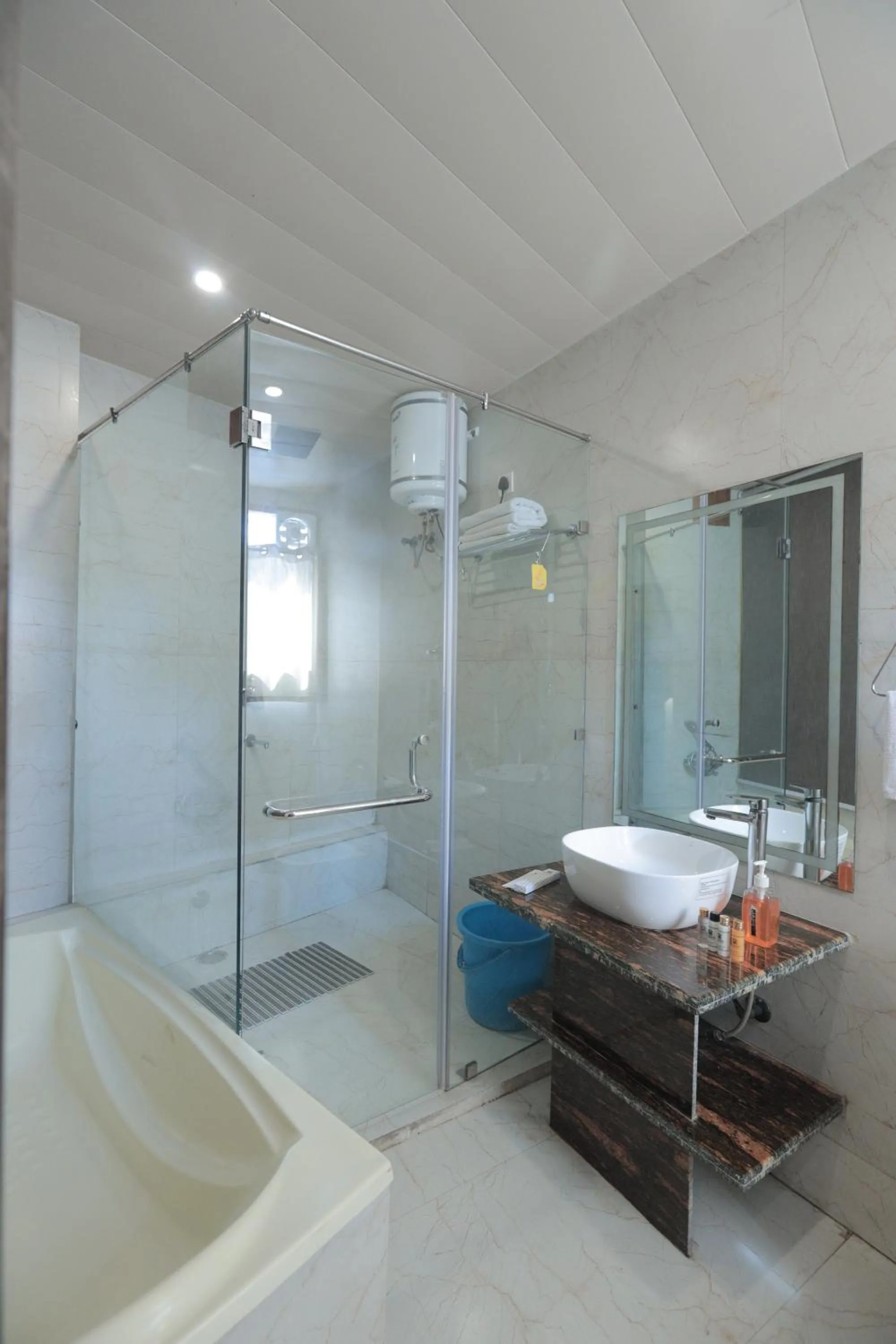 Shower in Yogved Hospitality & Resort