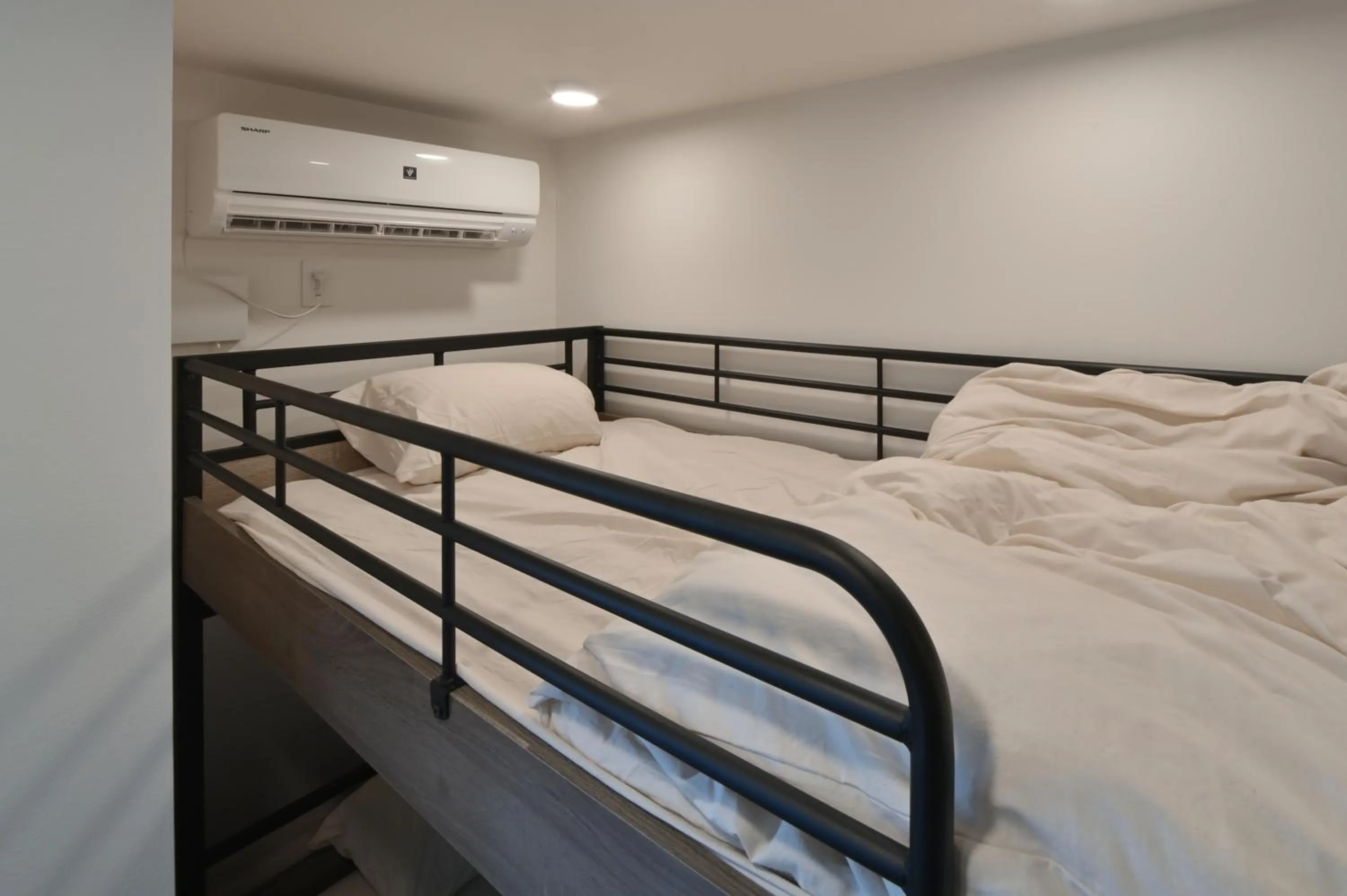 Bed in Stylewood Nishi-Shinjuku by Tranova