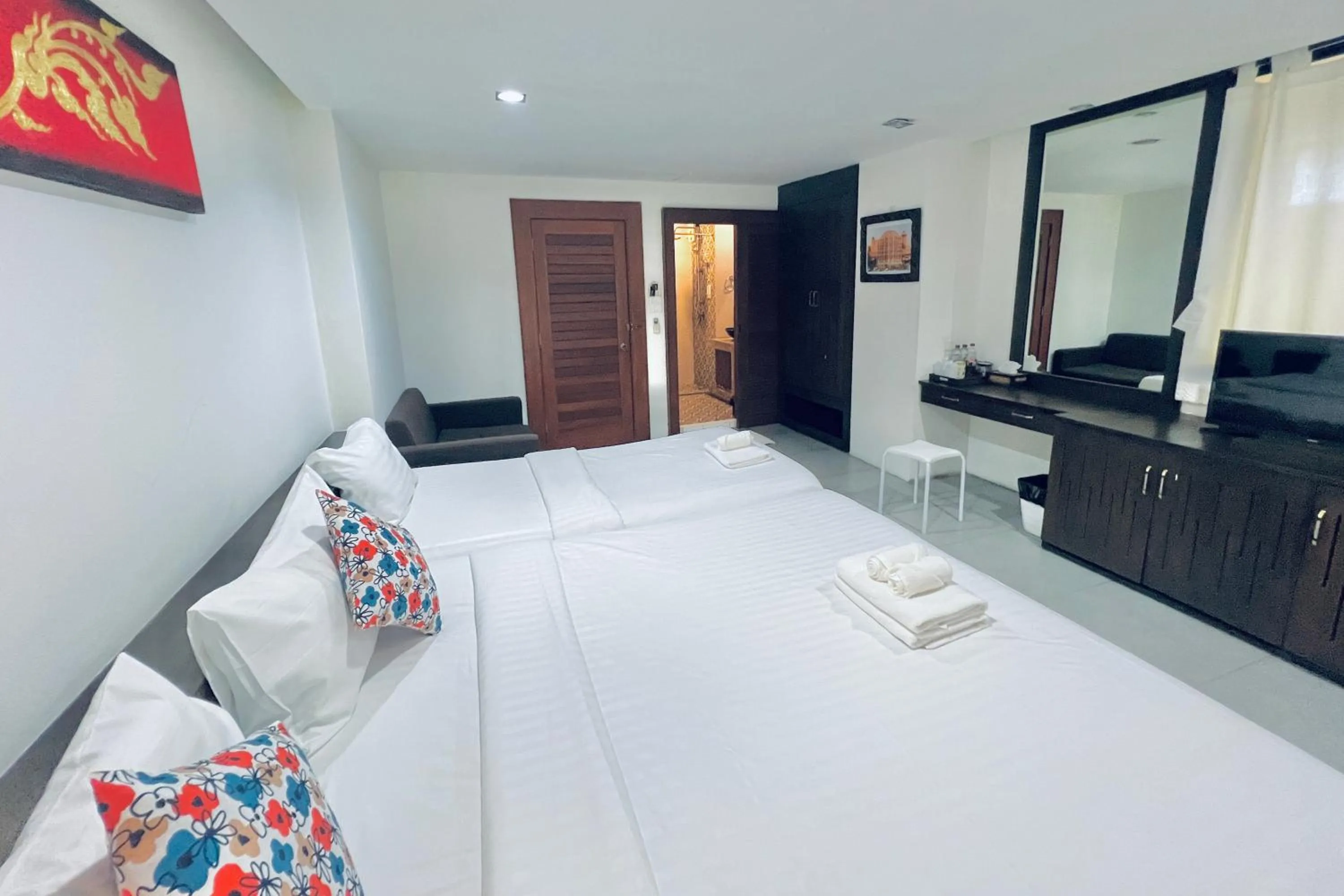 Bed in De Nawarat Chiangmai Boutique Apartment