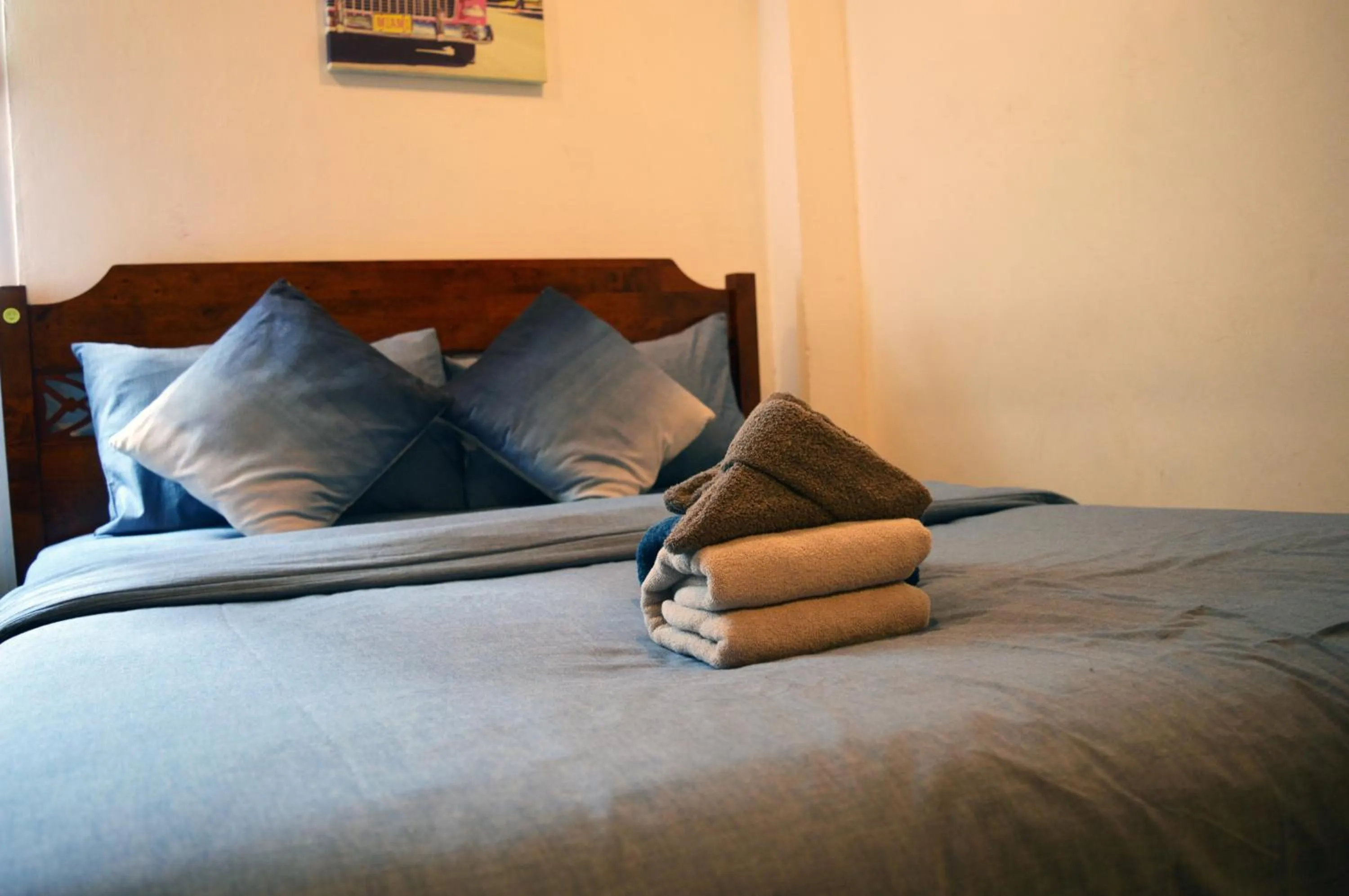 Bed in De Nawarat Chiangmai Boutique Apartment