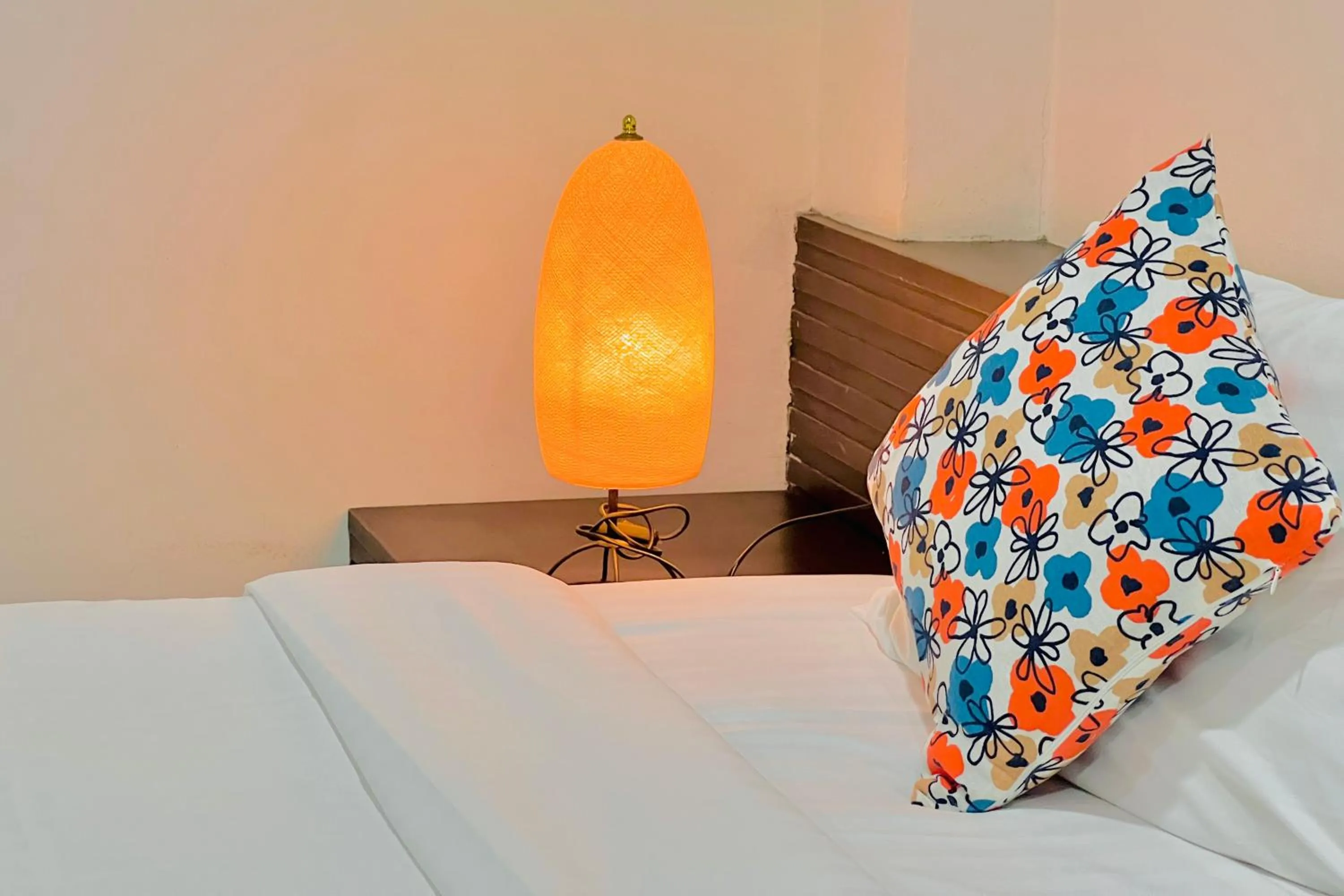 Bed in De Nawarat Chiangmai Boutique Apartment