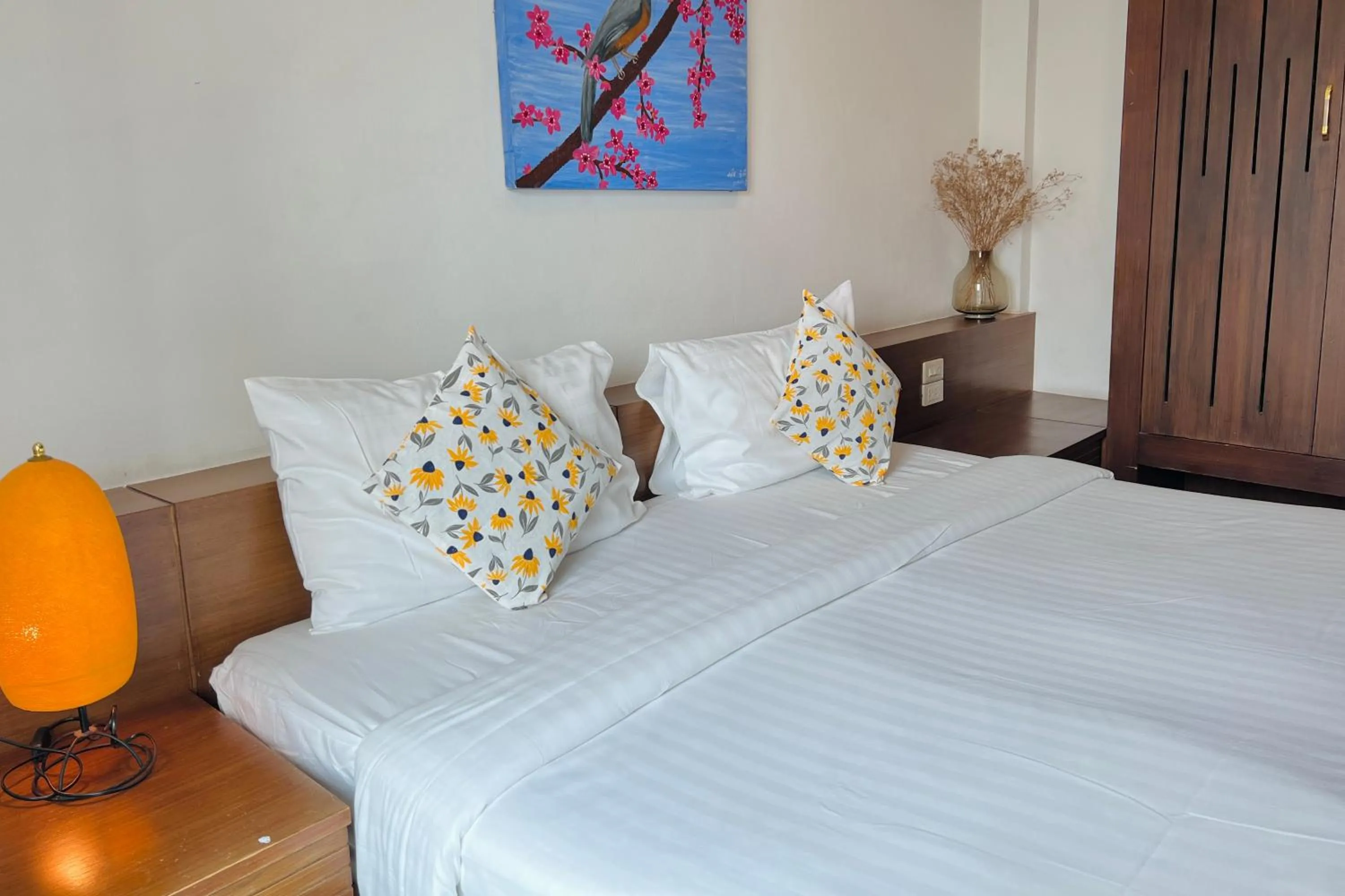 Bed in De Nawarat Chiangmai Boutique Apartment