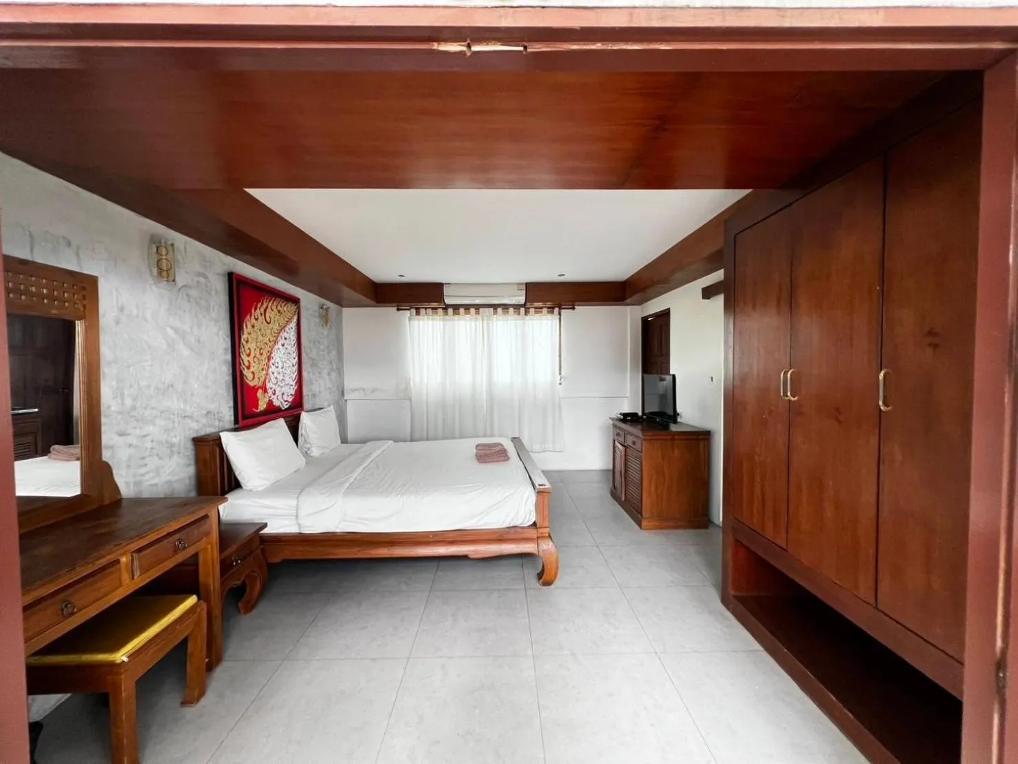 Bed in De Nawarat Chiangmai Boutique Apartment