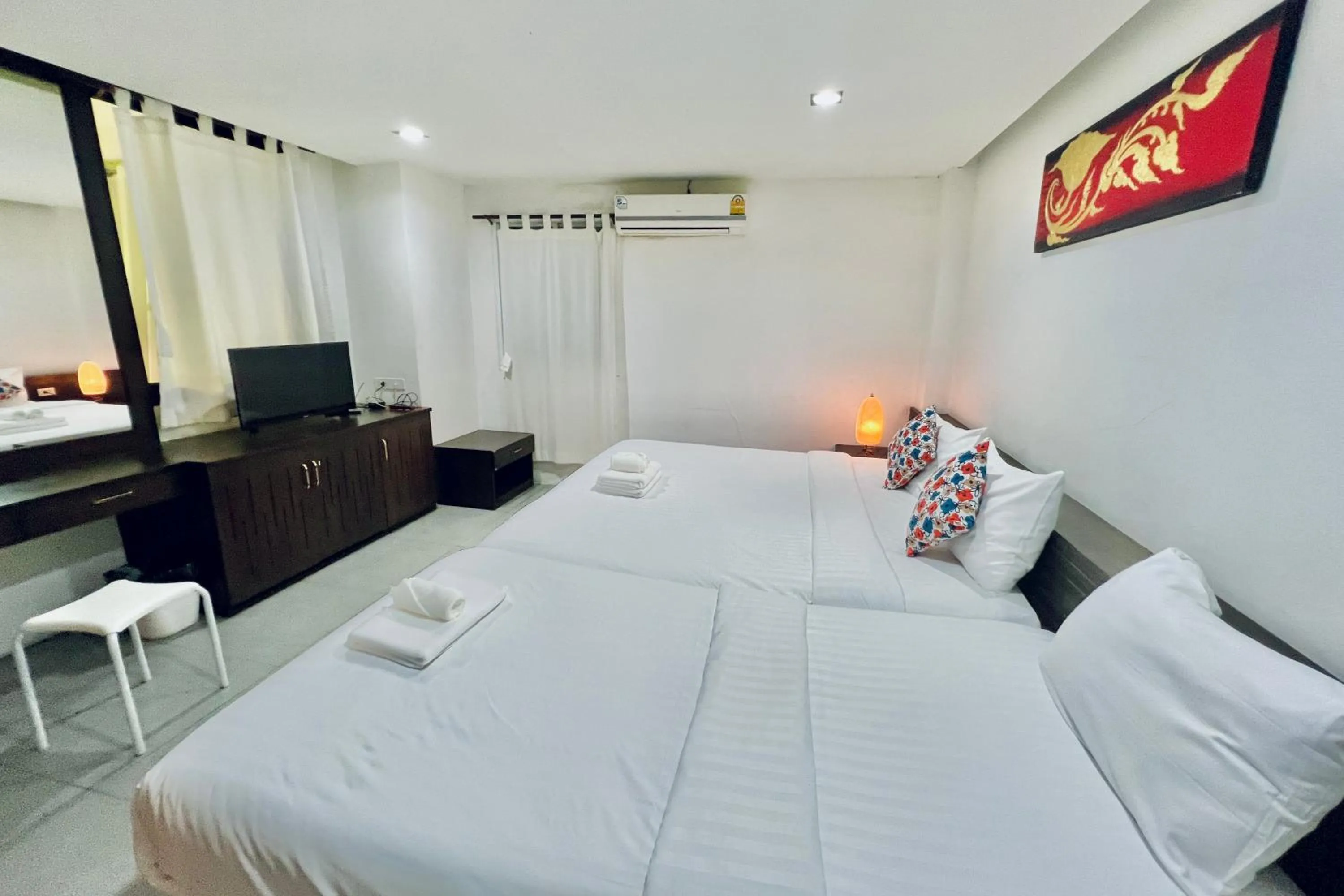 Bed in De Nawarat Chiangmai Boutique Apartment