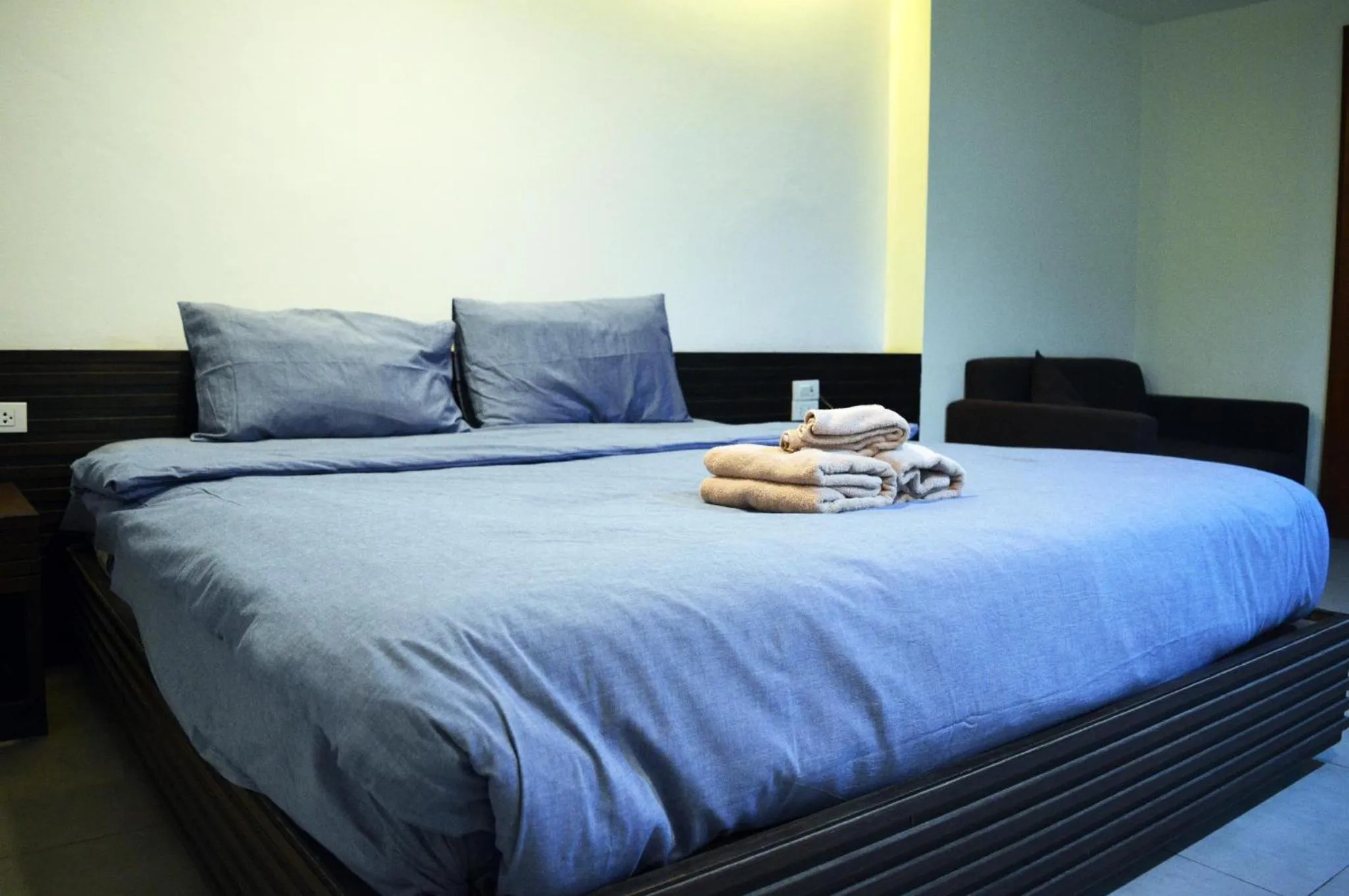 Bed in De Nawarat Chiangmai Boutique Apartment