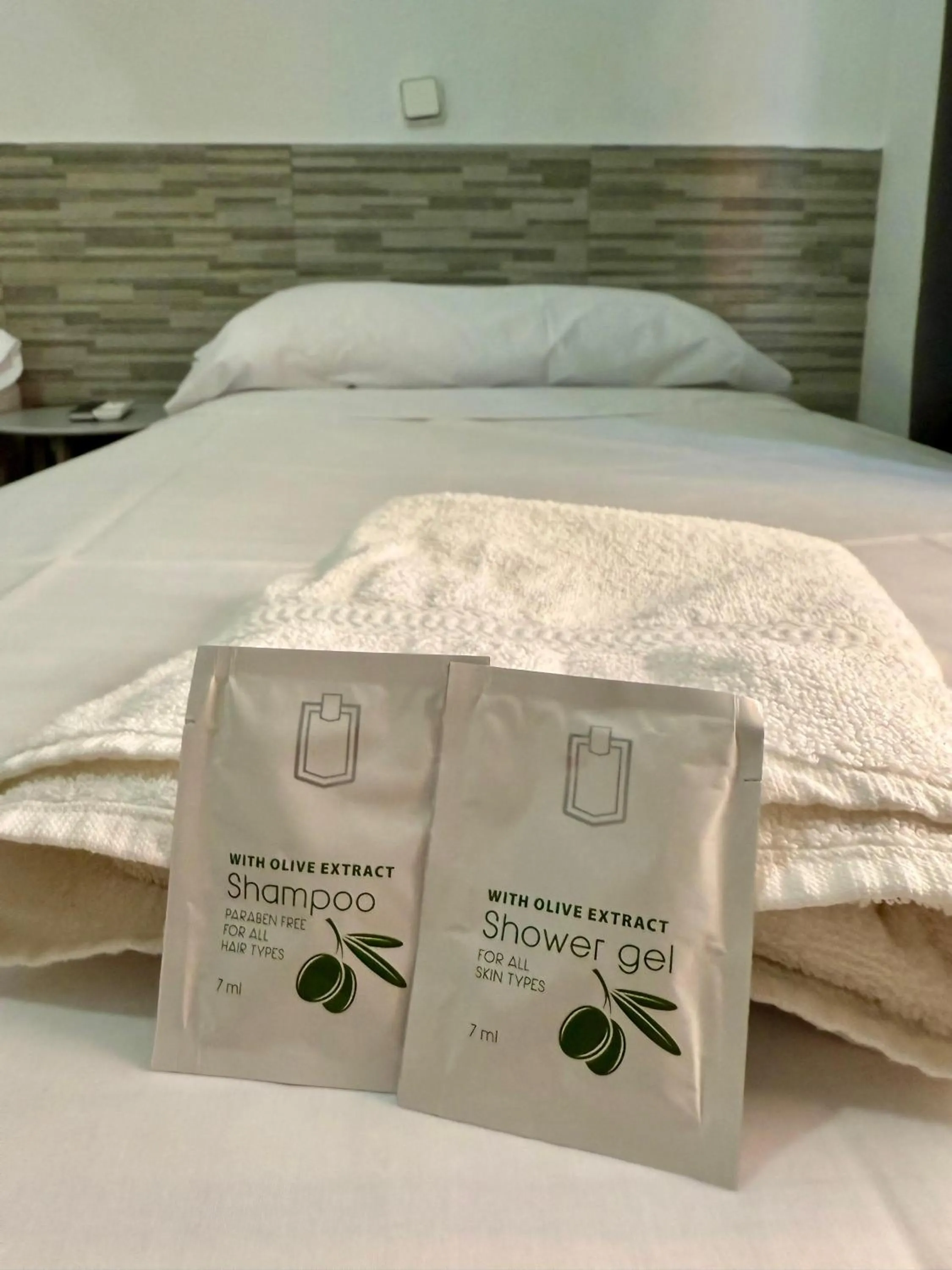 towels, Bed in PENSIÓN ROSA