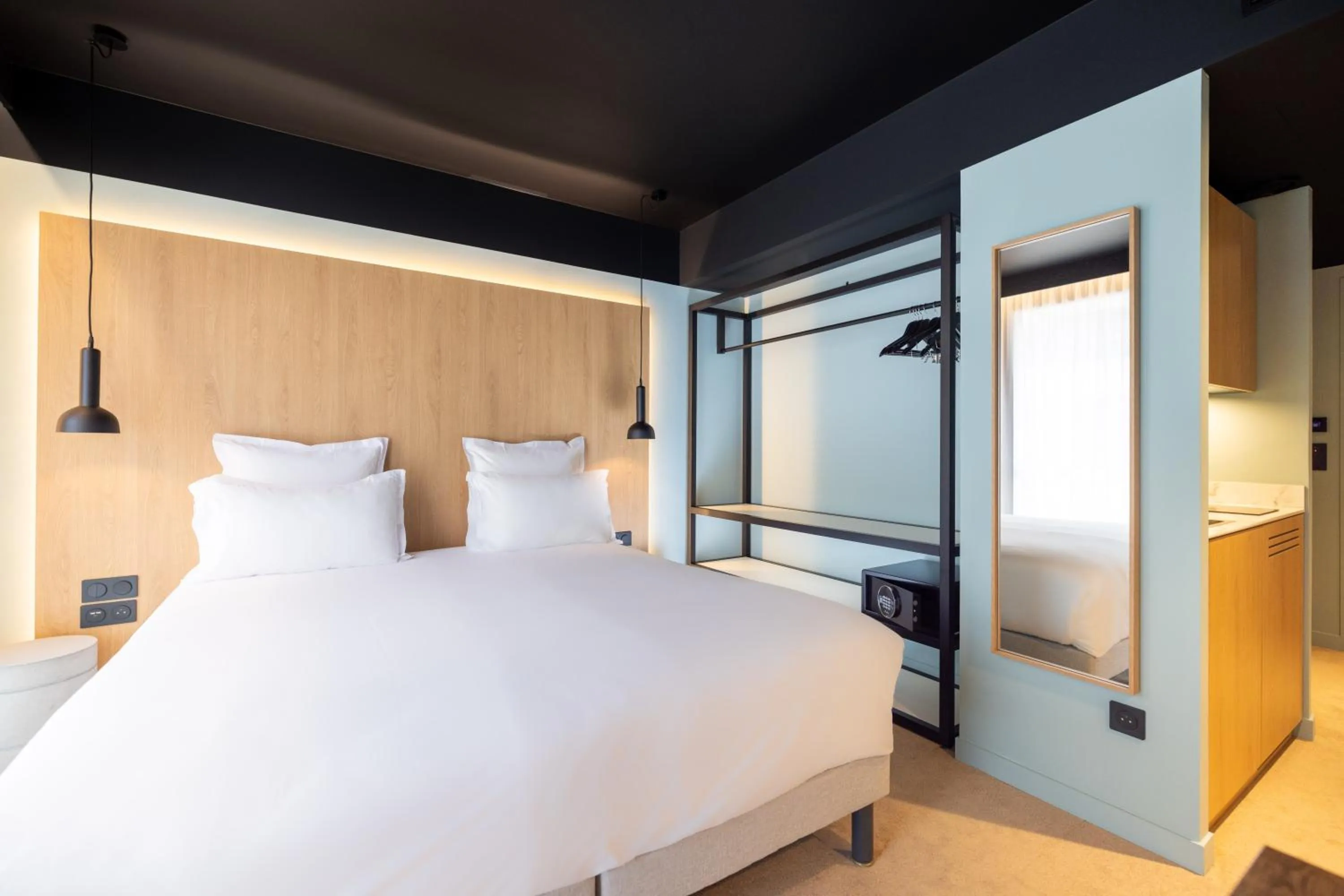 Bed in KOPSTER Hotel Residence Paris Ouest Colombes