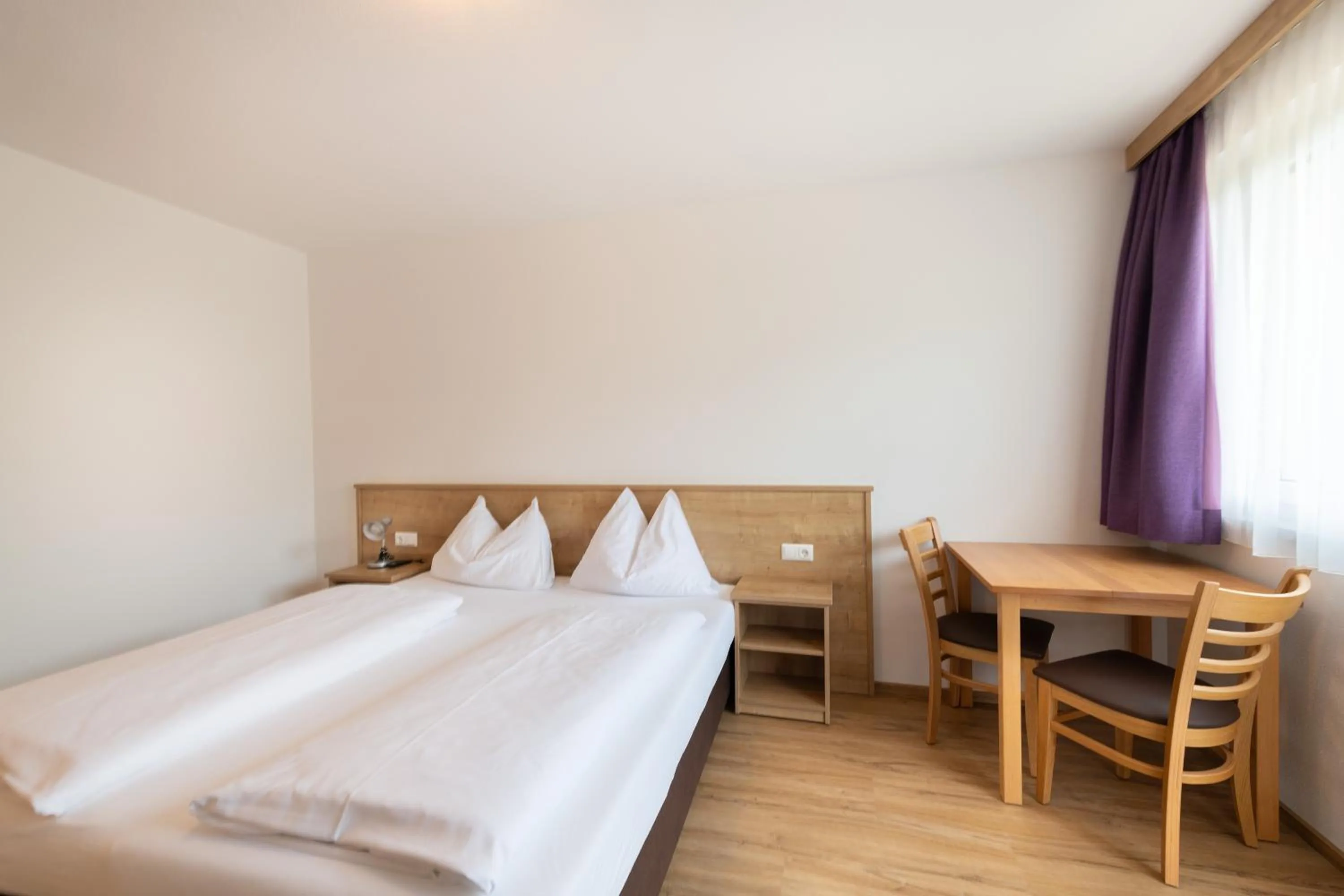 Bed in Hotel-Pension Egger