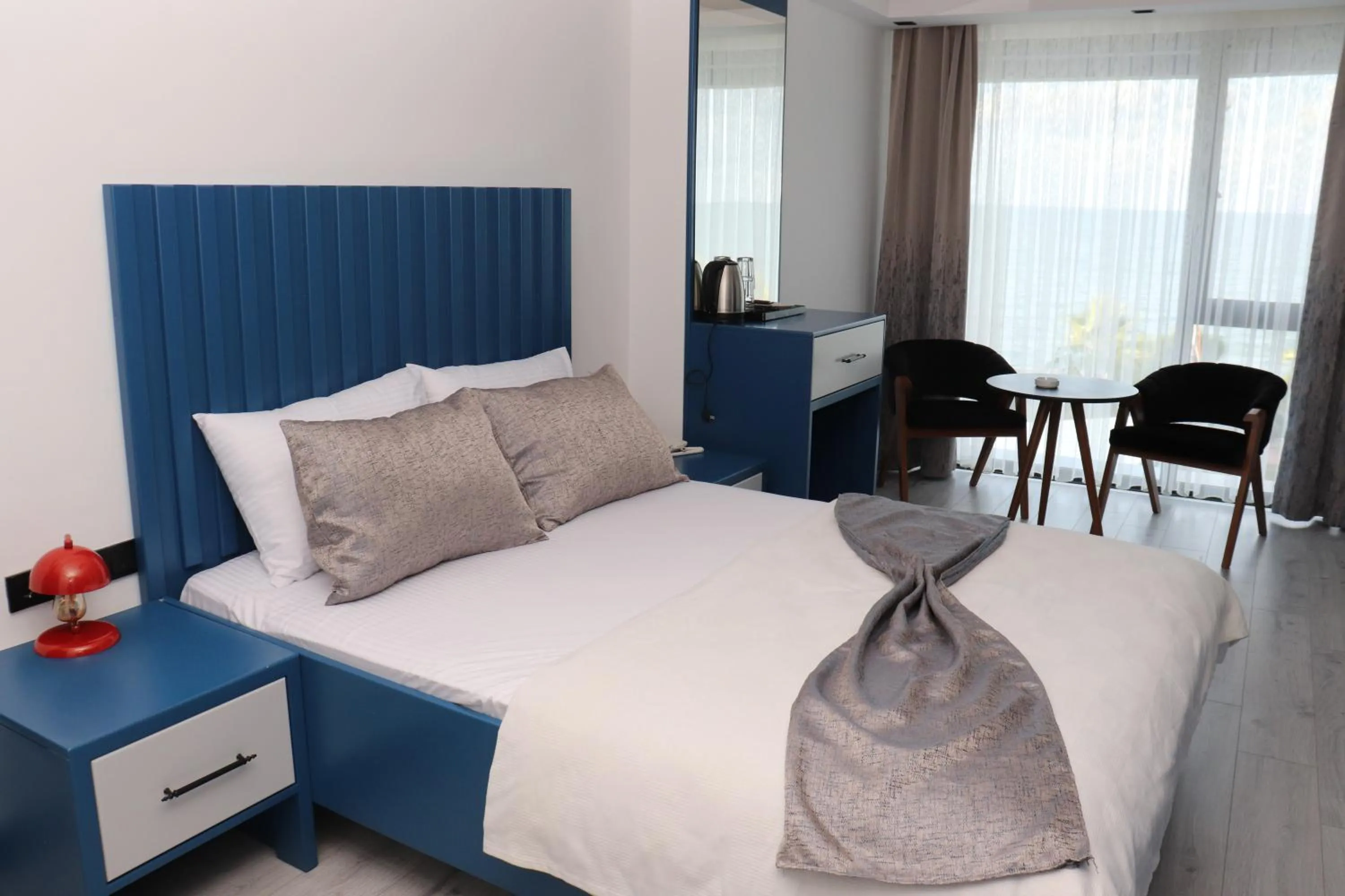 Bed in Blue Ay Boutique Hotel