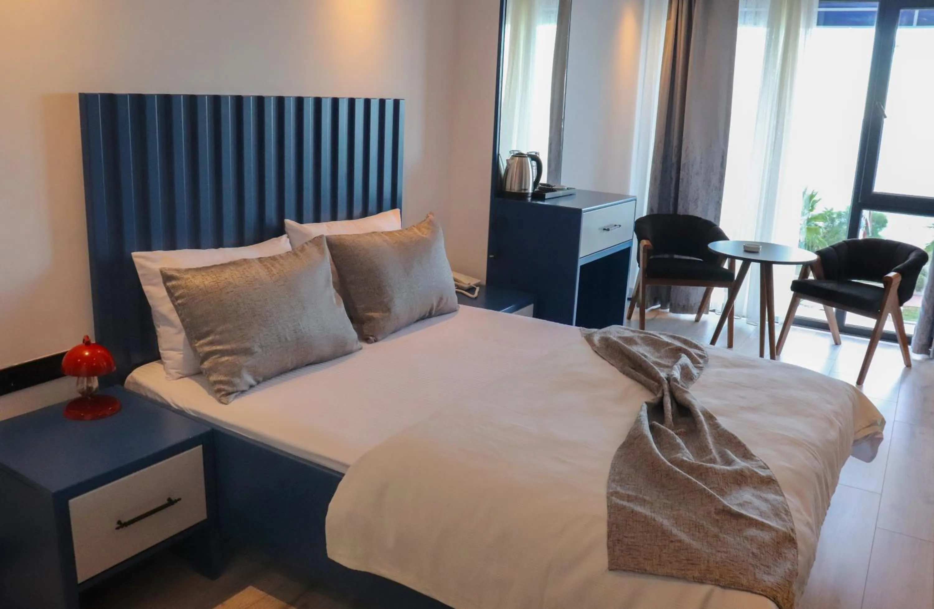 Bed in Blue Ay Boutique Hotel