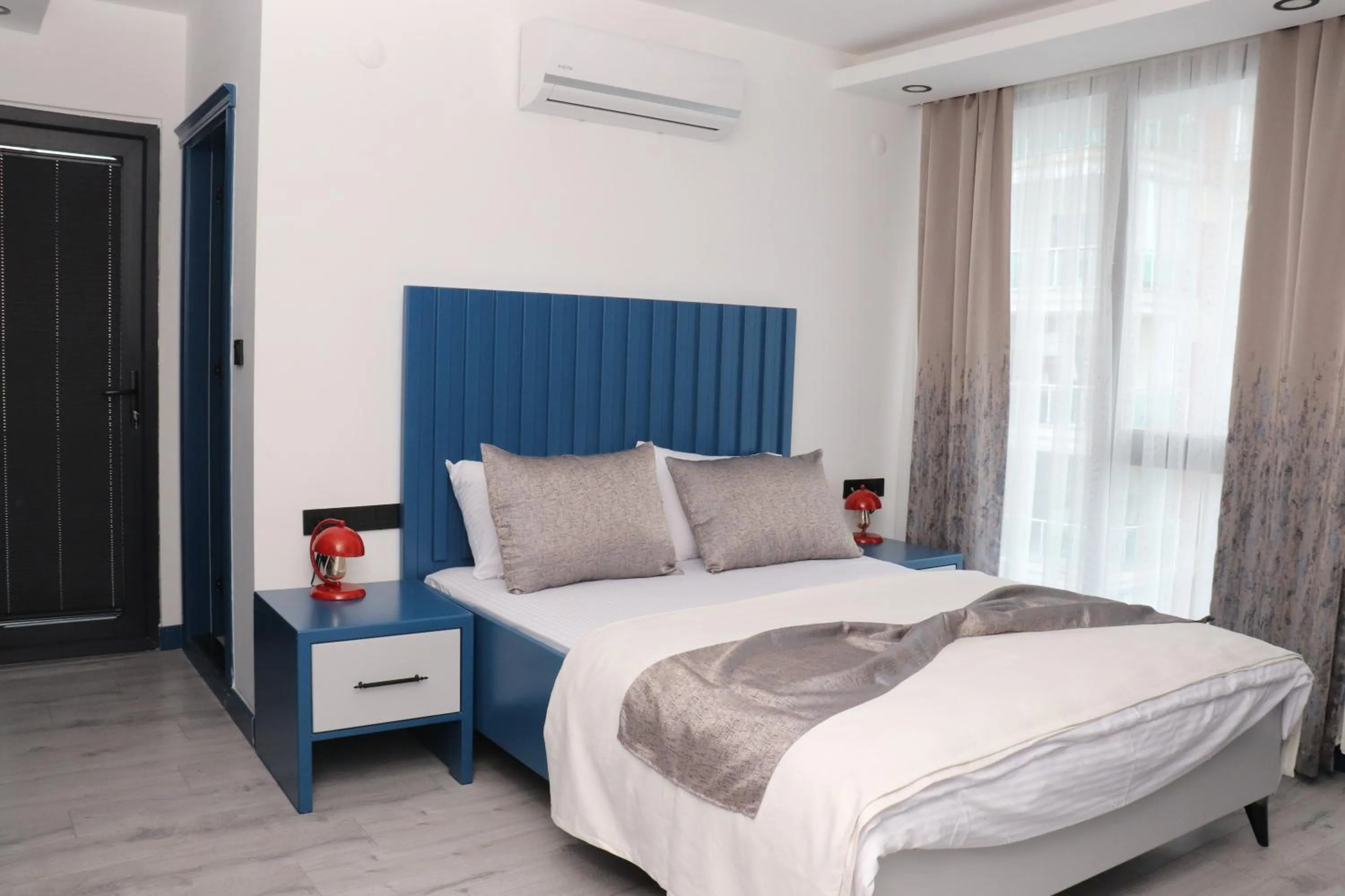 Bed in Blue Ay Boutique Hotel