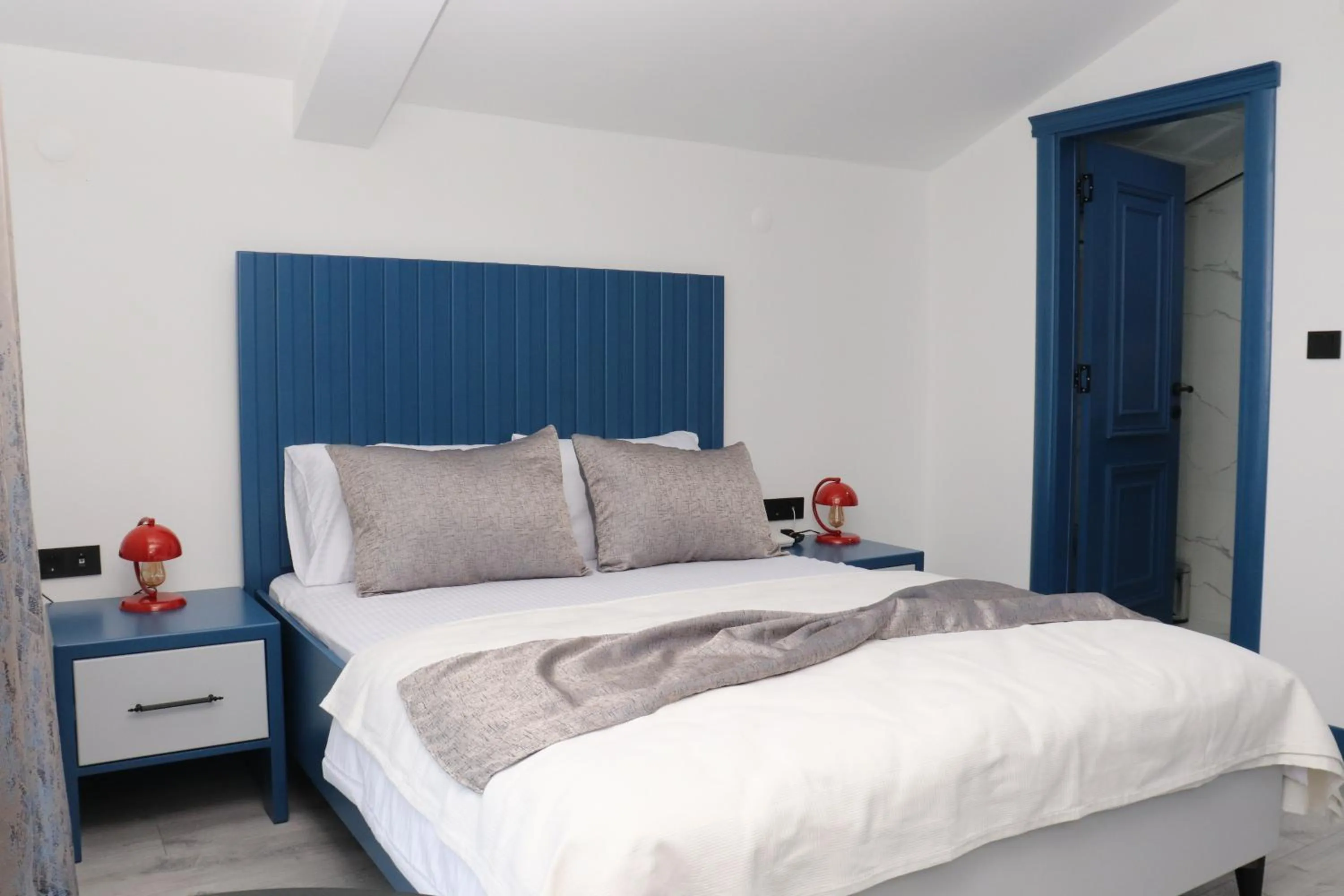 Bed in Blue Ay Boutique Hotel