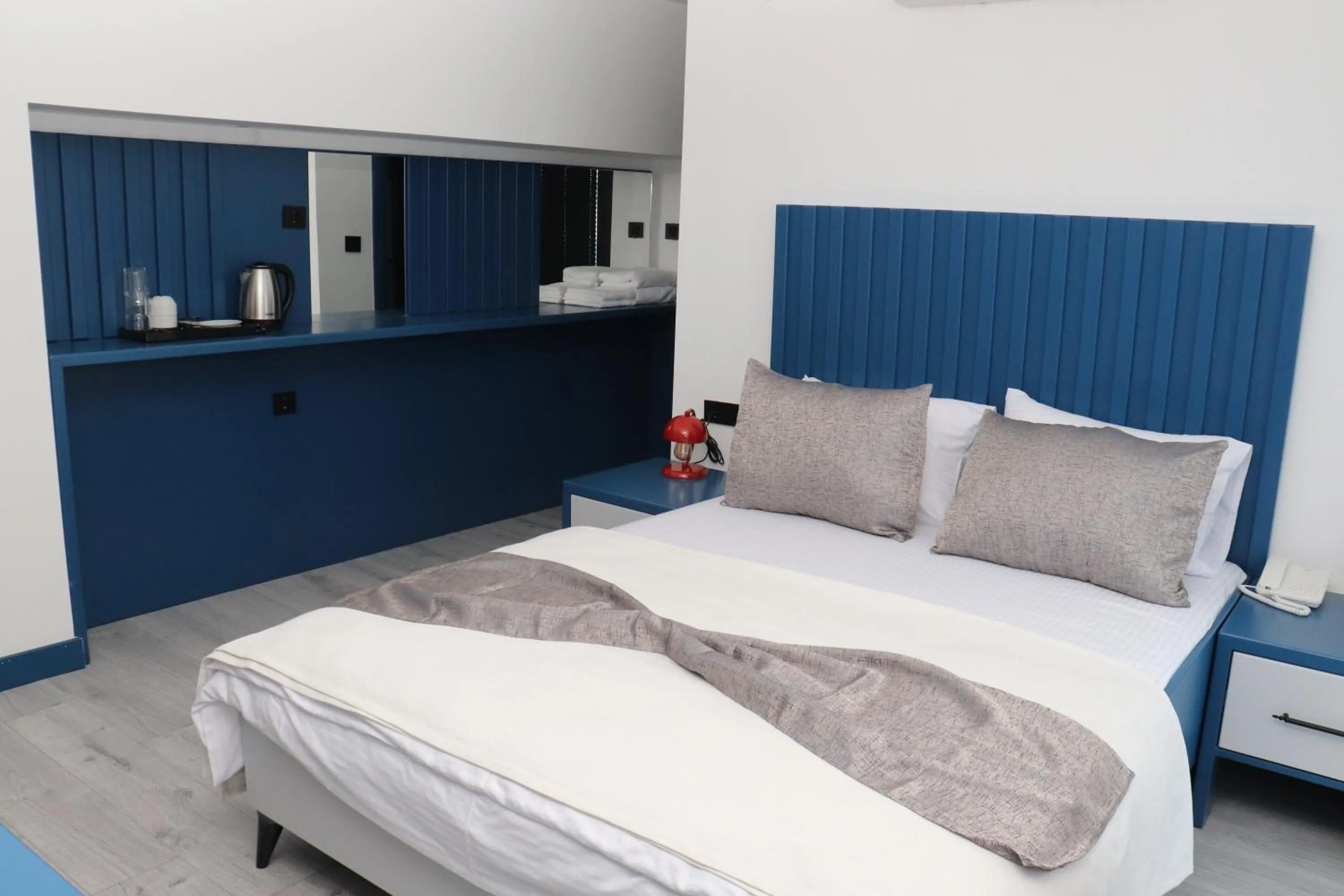 Bed in Blue Ay Boutique Hotel