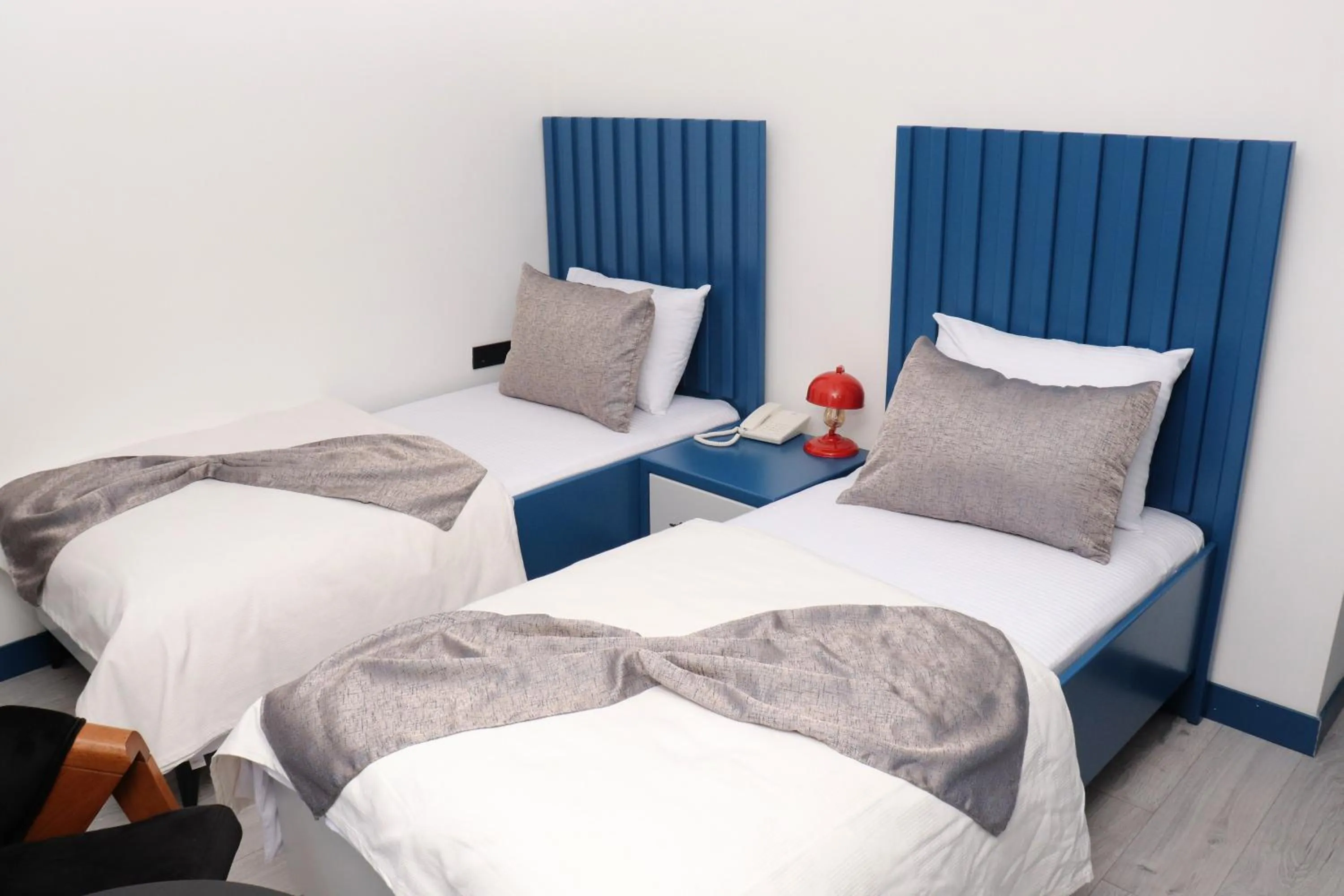 Bed in Blue Ay Boutique Hotel