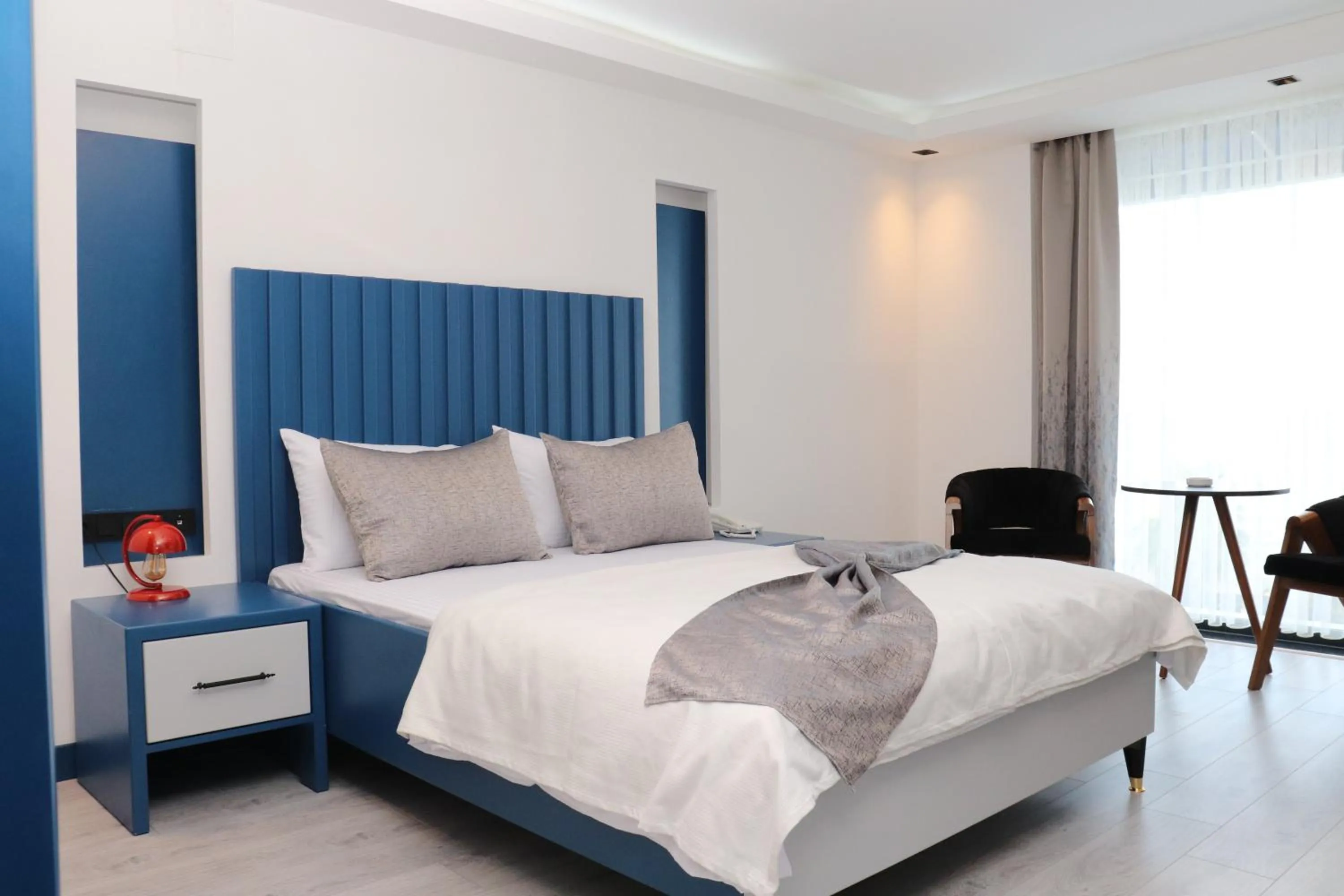 Bed in Blue Ay Boutique Hotel