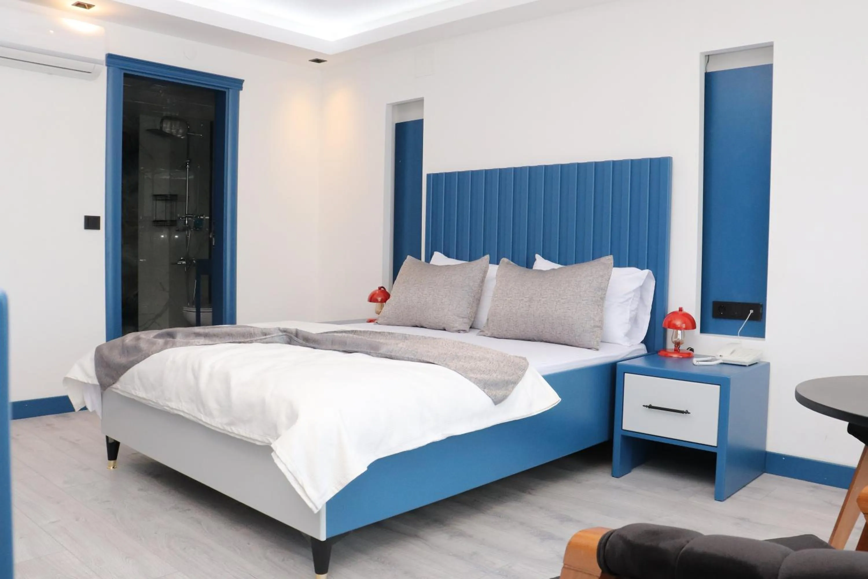 Bed in Blue Ay Boutique Hotel