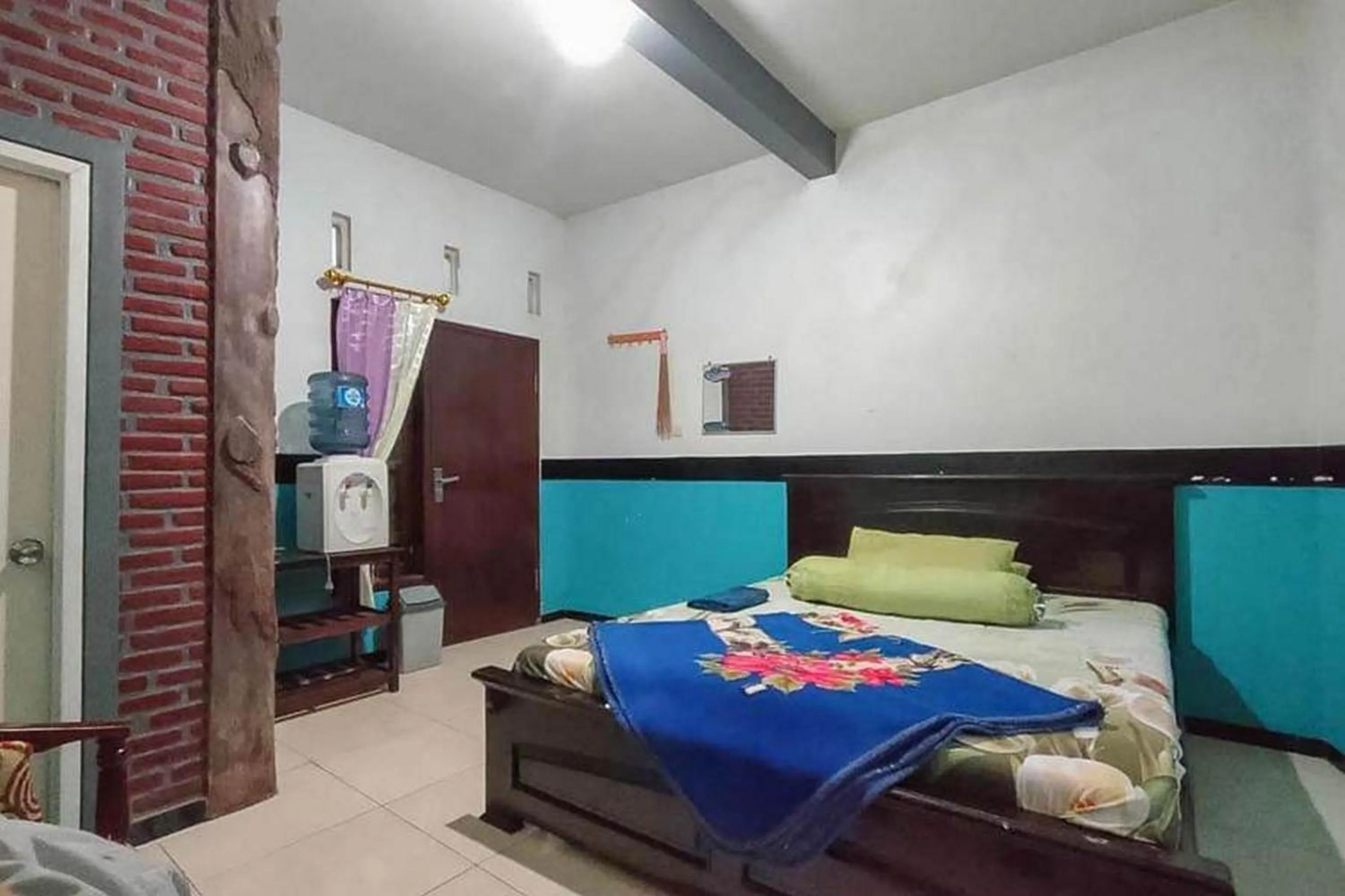 Bed in Villa Ghazani 4 at Desa Wisata Songgokerto