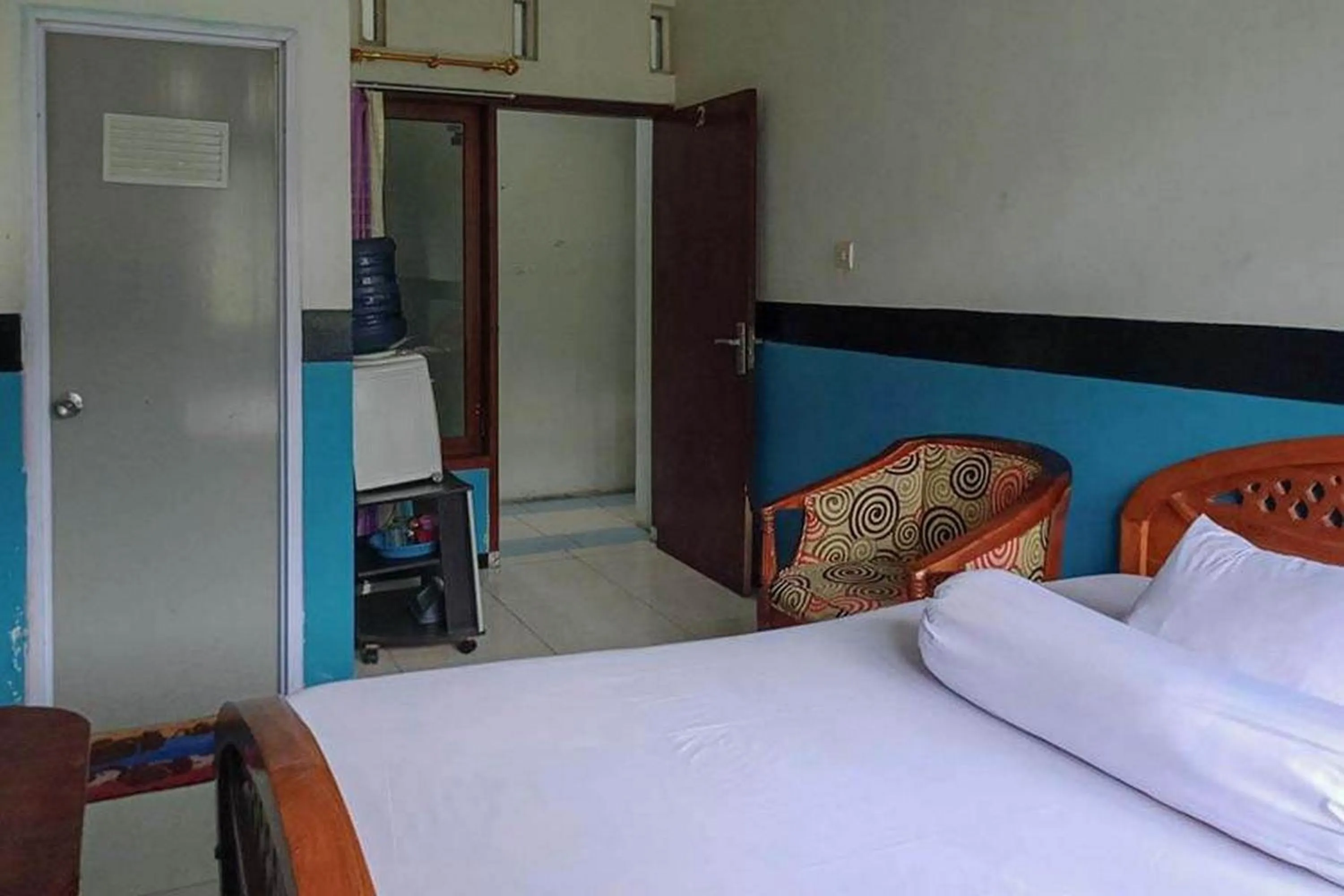 Bed in Villa Ghazani 4 at Desa Wisata Songgokerto