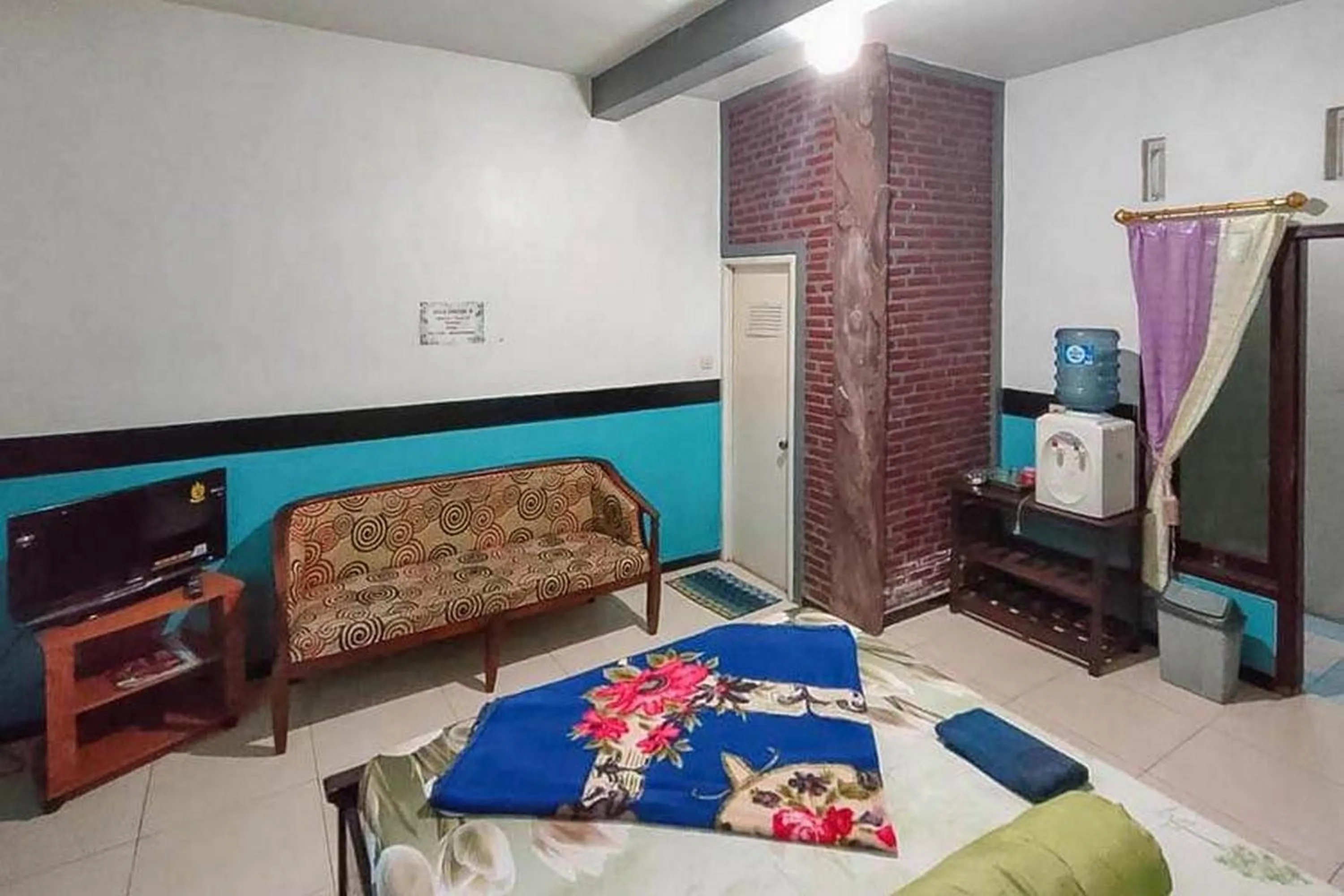 Bed in Villa Ghazani 4 at Desa Wisata Songgokerto