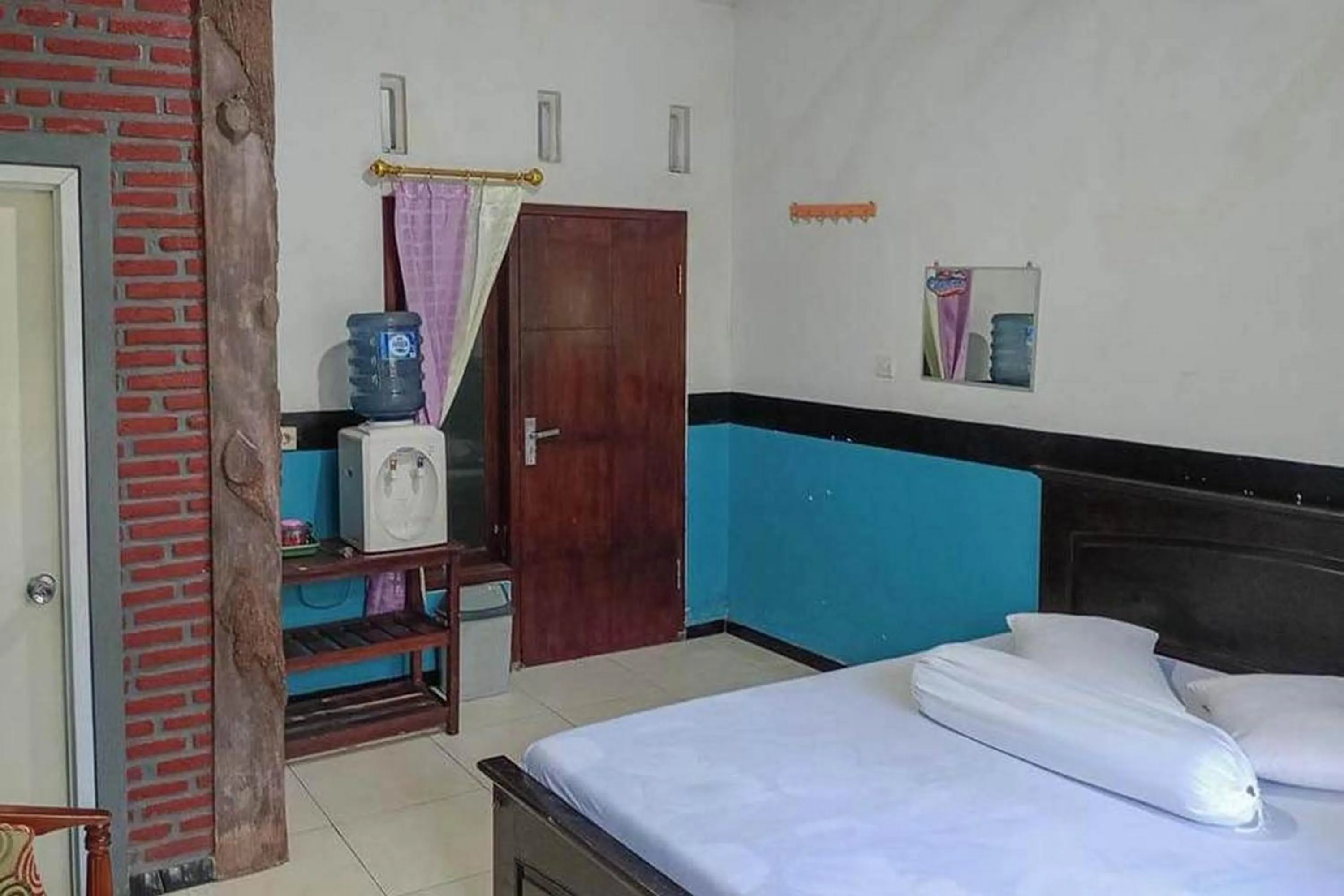 Bed in Villa Ghazani 4 at Desa Wisata Songgokerto