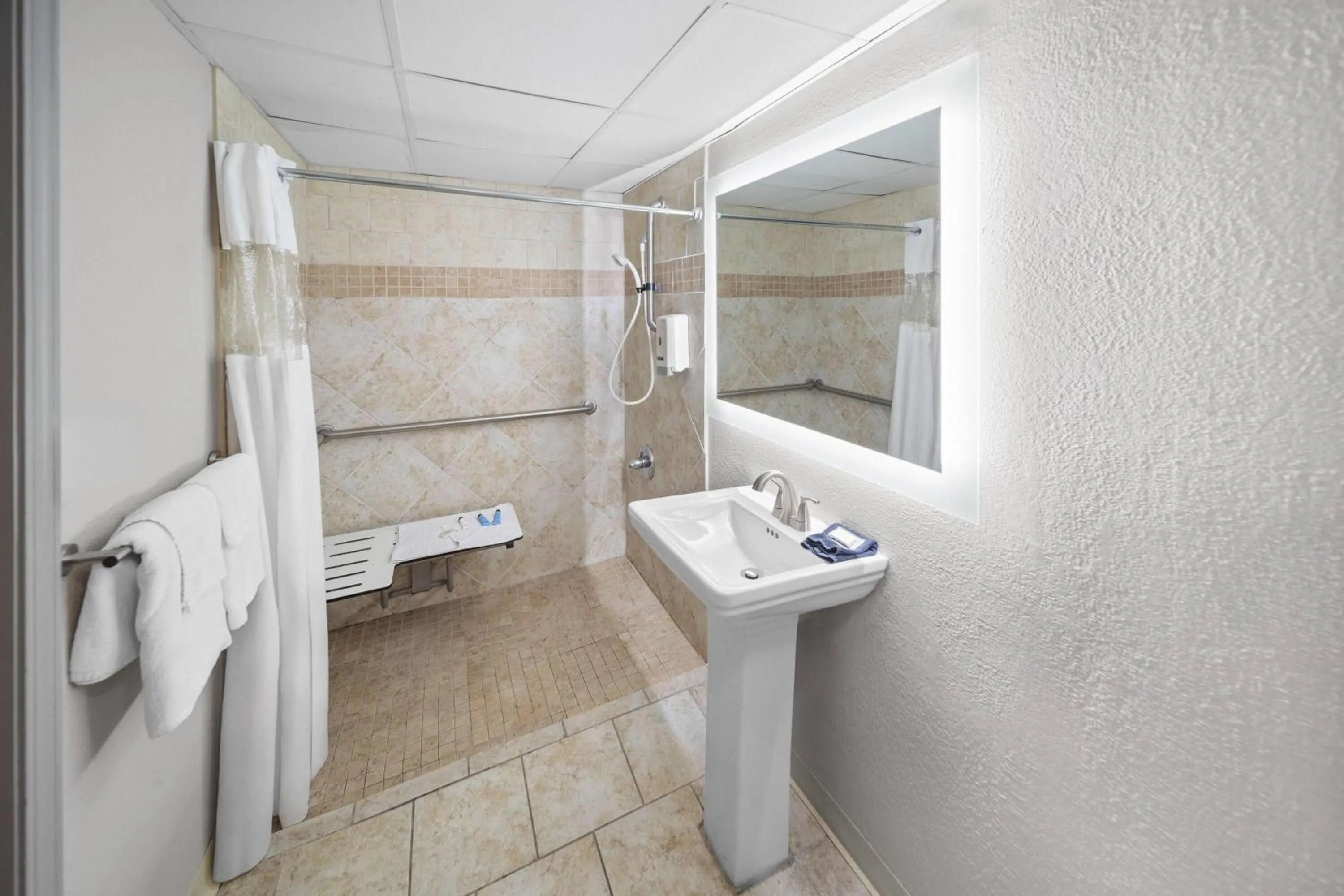 Shower in Angel Inn Near IMAX, a Travelodge by Wyndham