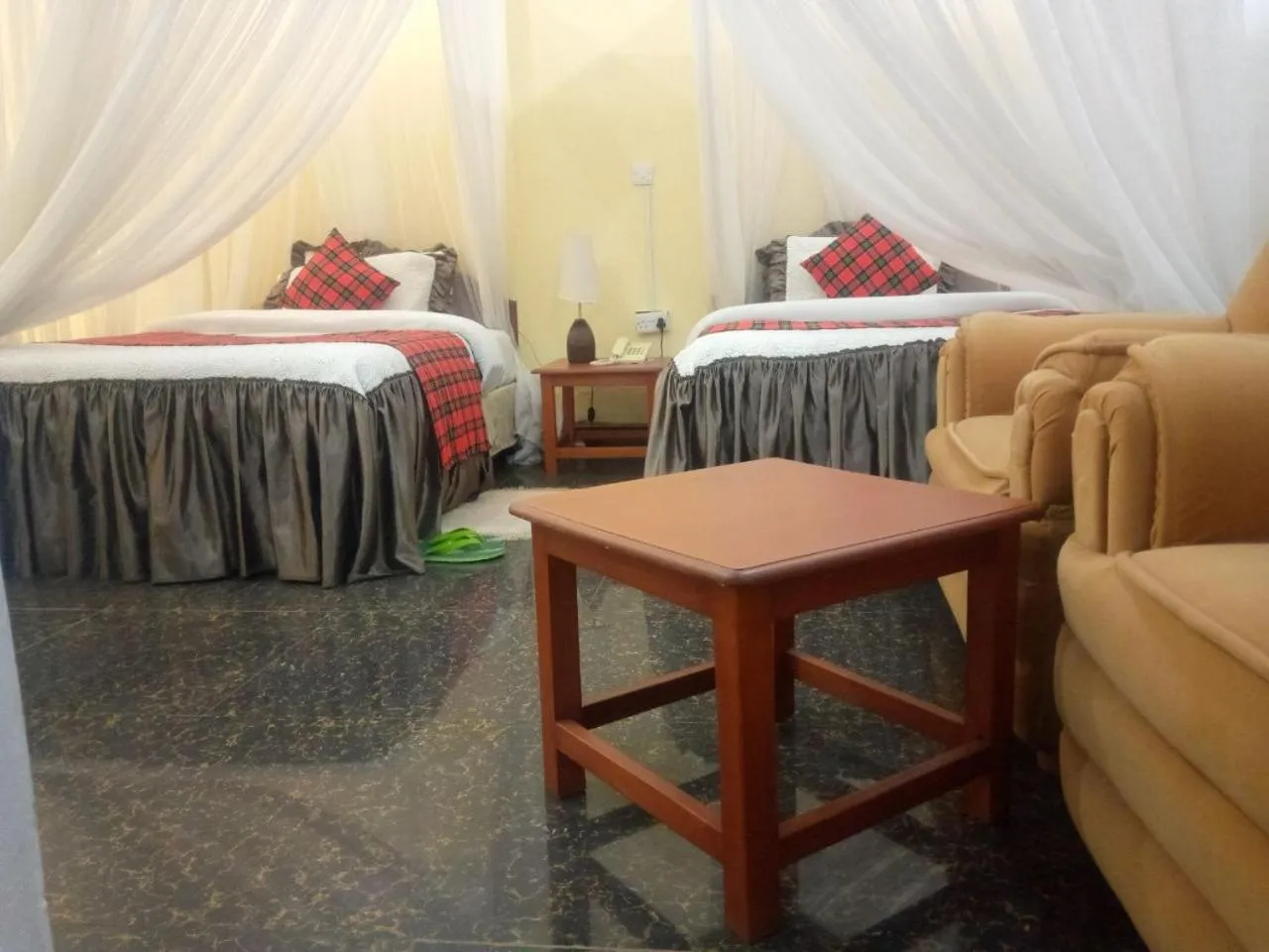 Bed in Karibu Heritage House