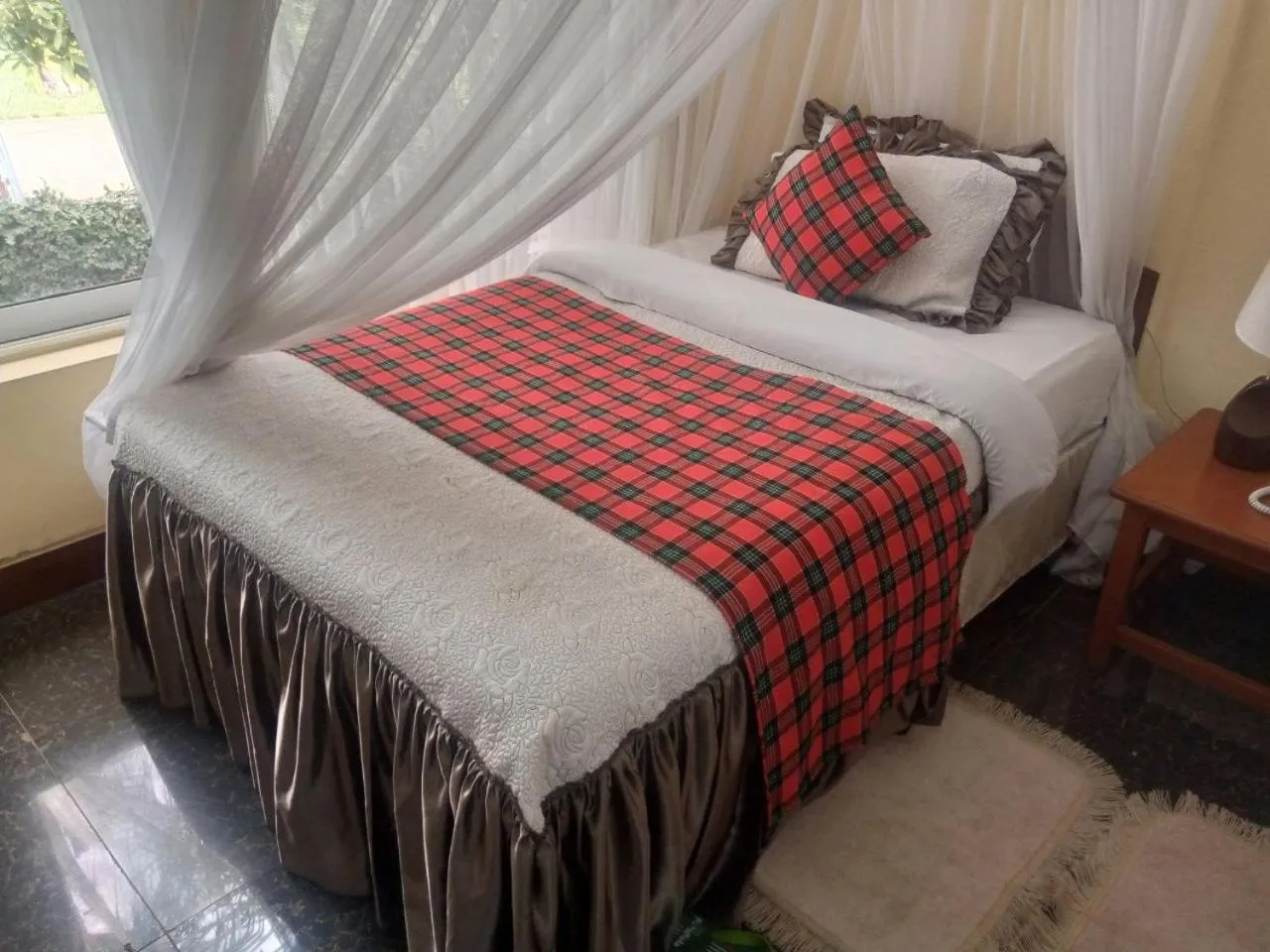 Bed in Karibu Heritage House