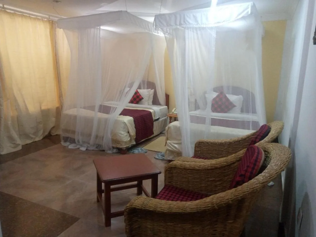 Bed in Karibu Heritage House