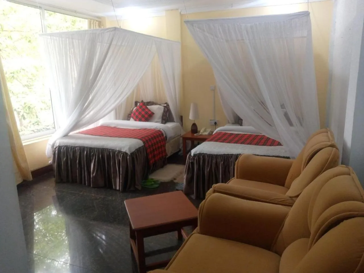 Bed in Karibu Heritage House