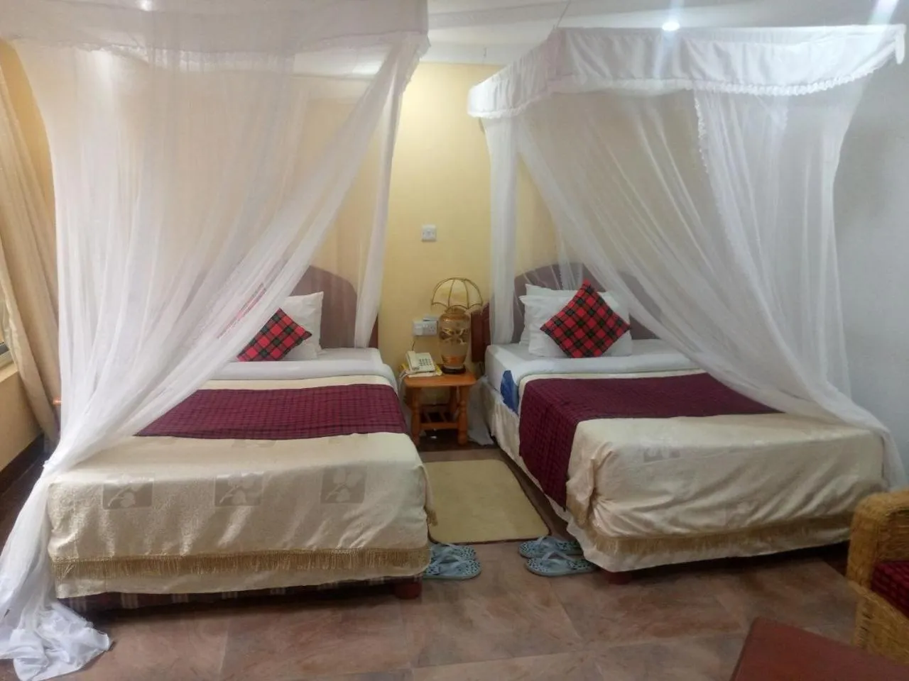 Bed in Karibu Heritage House