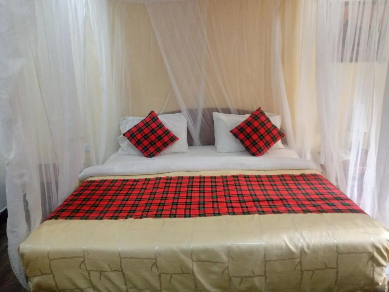 Bed in Karibu Heritage House