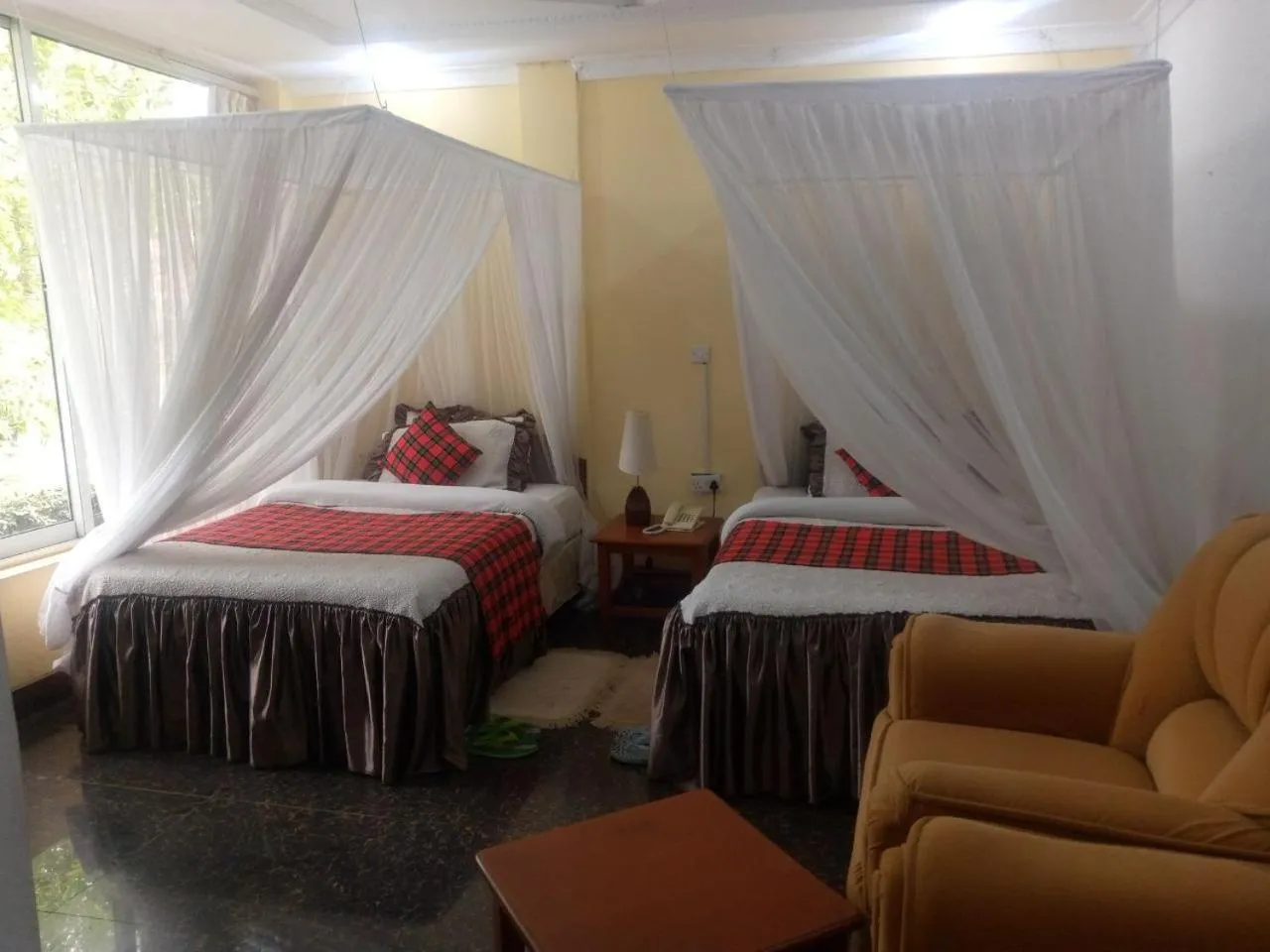 Bed in Karibu Heritage House