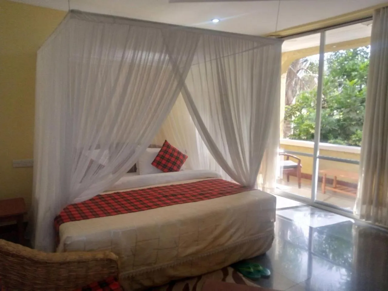 Bed in Karibu Heritage House