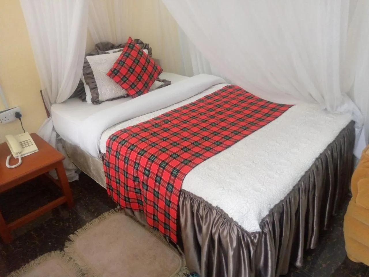 Bed in Karibu Heritage House